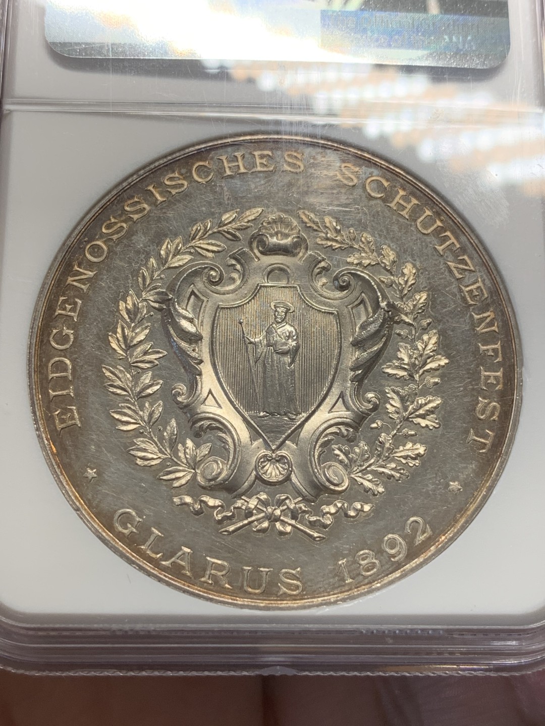 《竞宝斋》第109场-周日，周一 ，周四3场连拍（全场包邮） NGC MS61 瑞士 1892年 格拉鲁斯射击节大银章 镜面底板 金色包浆 低评好品好状态