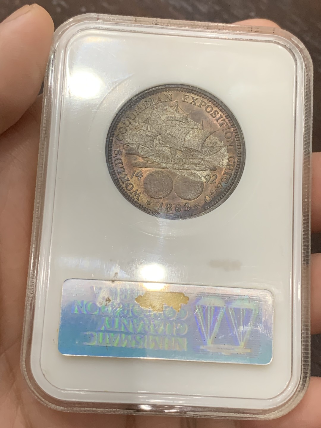 《竞宝斋》第109场-周日，周一 ，周四3场连拍（全场包邮） NGC-MS64 美国 1893年 哥伦布发现新大陆半圆银币 极品好彩 NGC老盒 背紫红色包浆 形成 帆船在雷电交加的暴风雨中乘风破浪 视觉