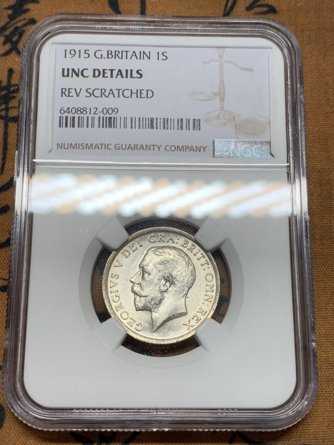 《竞宝斋》第109场-周日，周一 ，周四3场连拍（全场包邮） NGC-UNCD 英国 乔治五世 1915 先令，状态很好， 人像状态非常好