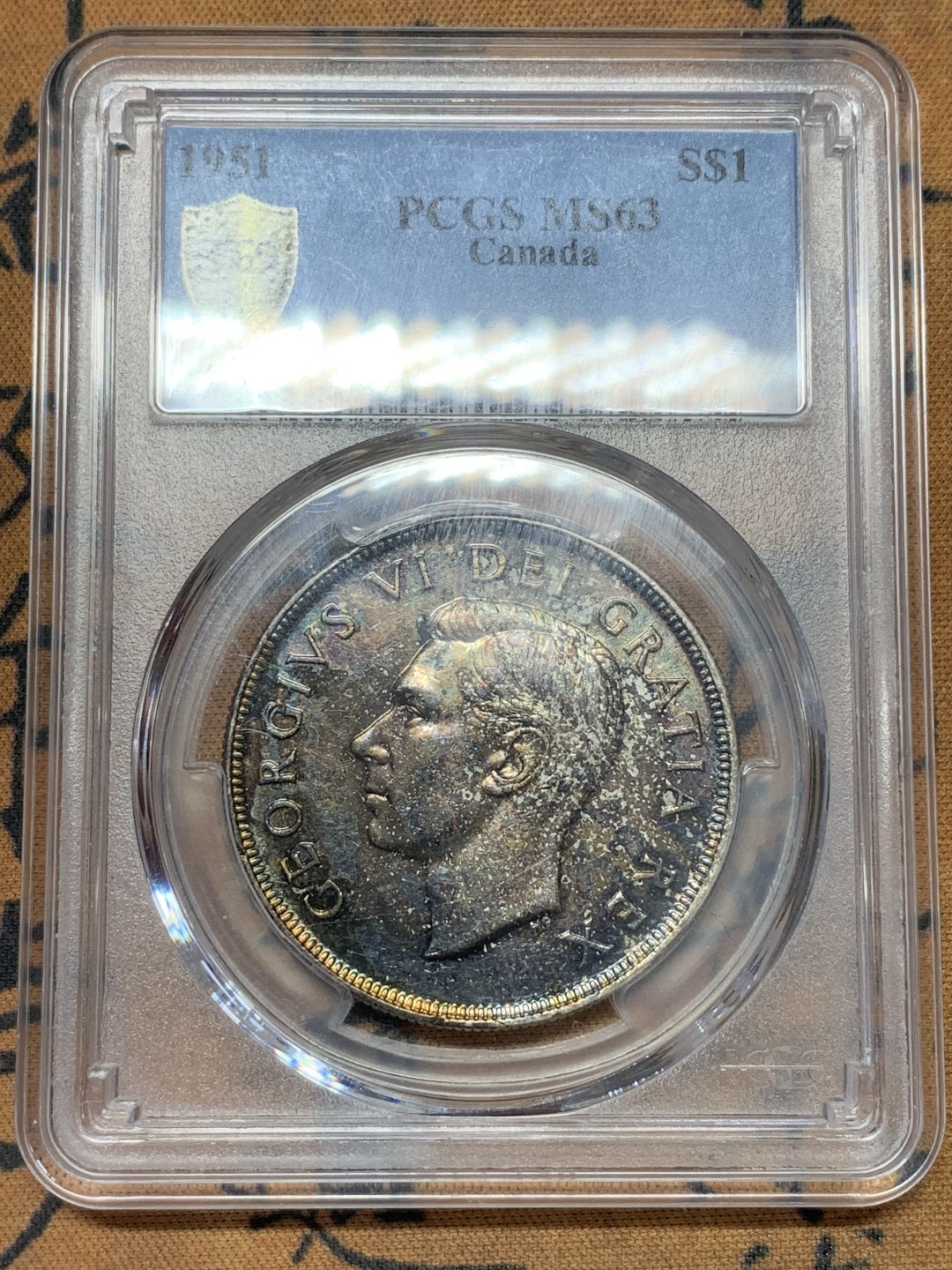 《竞宝斋》第109场-周日，周一 ，周四3场连拍（全场包邮） PCGS-MS63 加拿大 1951年 划船1加元银币 加拿大知名品种 五彩包浆 非常漂亮