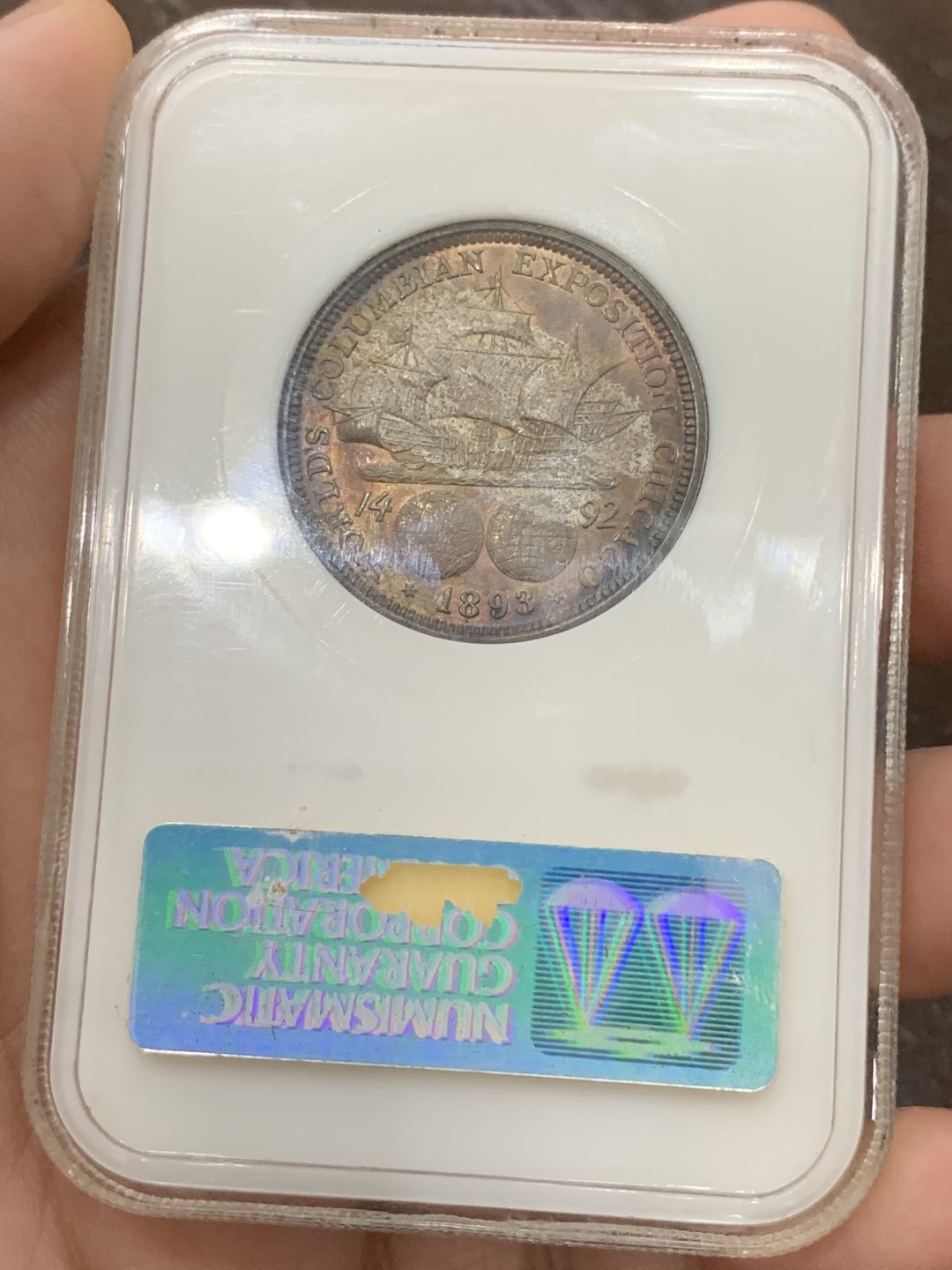 《竞宝斋》第109场-周日，周一 ，周四3场连拍（全场包邮） NGC-MS64 美国 1893年 哥伦布发现新大陆半圆银币 极品好彩 NGC老盒 背紫红色包浆 形成 帆船在雷电交加的暴风雨中乘风破浪 视觉