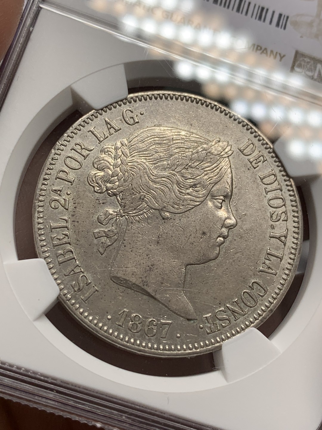 《竞宝斋》第109场-周日，周一 ，周四3场连拍（全场包邮） NGC AU55 西班牙1867年伊莎贝拉猪头妹2埃斯库多大银币，比20R面值少见