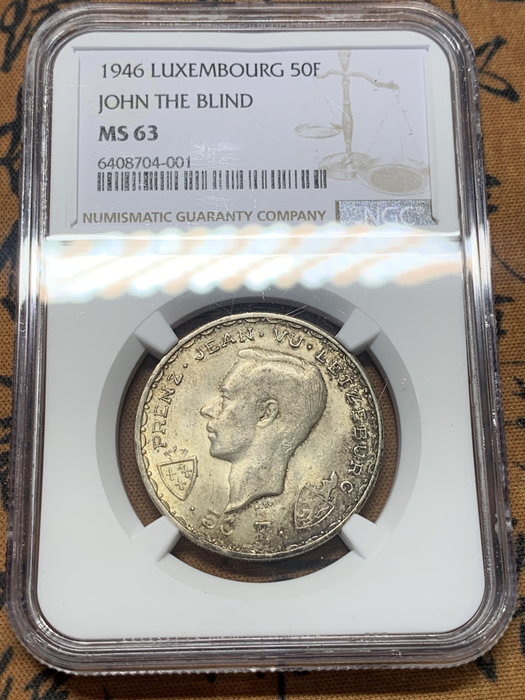 《竞宝斋》第111场-周日，周一 ，2场连拍（全场包邮） NGC-MS63 卢森堡1946年 马剑50法郎银币 酱彩包浆