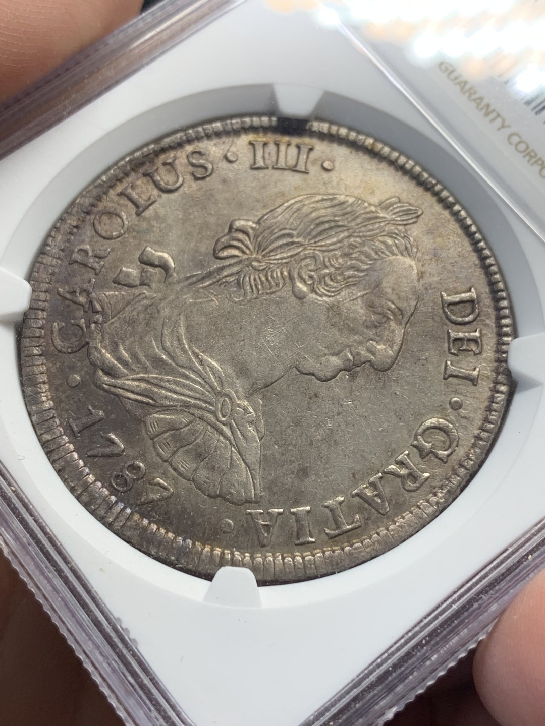 《竞宝斋》第111场-周日，周一 ，2场连拍（全场包邮） NGC UNC 玻利维亚 1787年 卡三 双柱大银币 标签为包浆等同于P97标签，可收藏