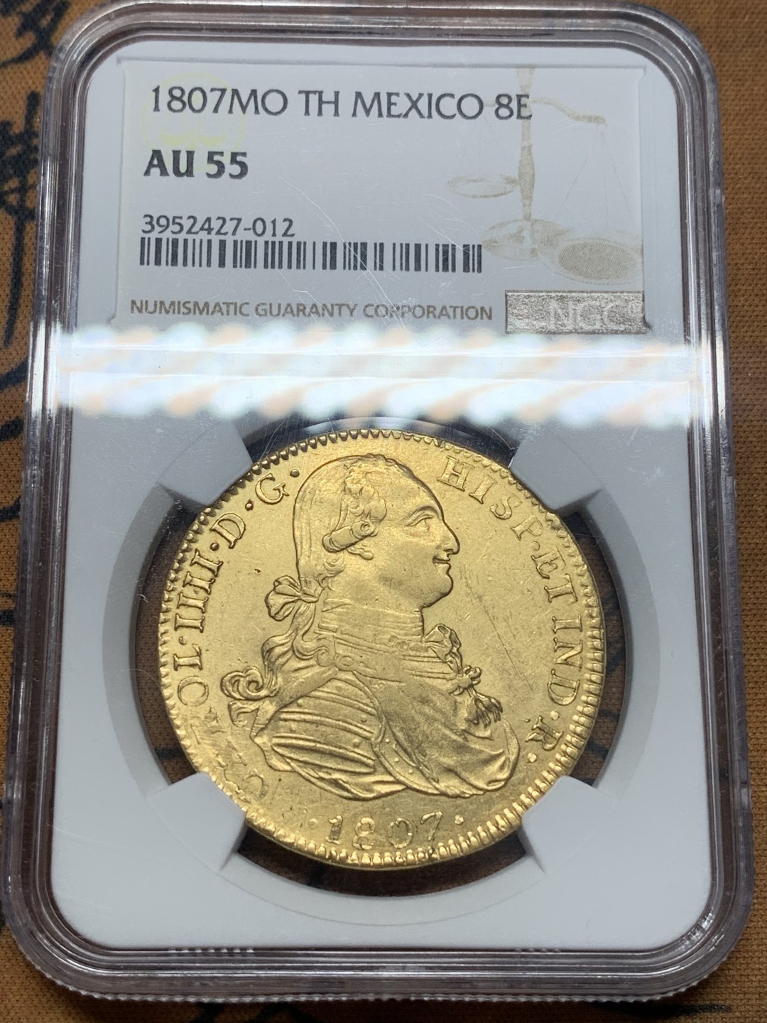 《竞宝斋》第111场-周日，周一 ，2场连拍（全场包邮） NGC-AU55 1807年西属墨西哥卡洛斯四世8埃斯库多金币 墨西哥的金币比哥伦比亚、智利、秘鲁都少见且昂贵，这枚币面干净没有铸缺 人物深打 难得