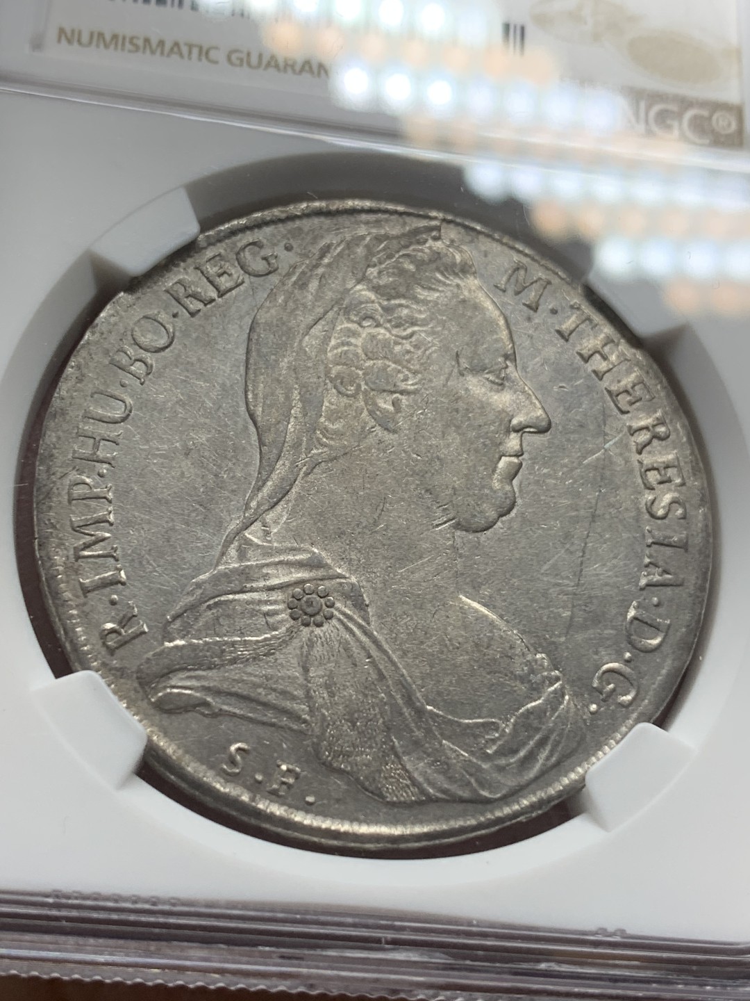 《竞宝斋》第111场-周日，周一 ，2场连拍（全场包邮） NGC-AUD 奥地利“1780年”特蕾莎1泰勒银币 1817-1833年铸造 威尼斯 对应目录编号应该是37a N就给了早期后铸缺失精准