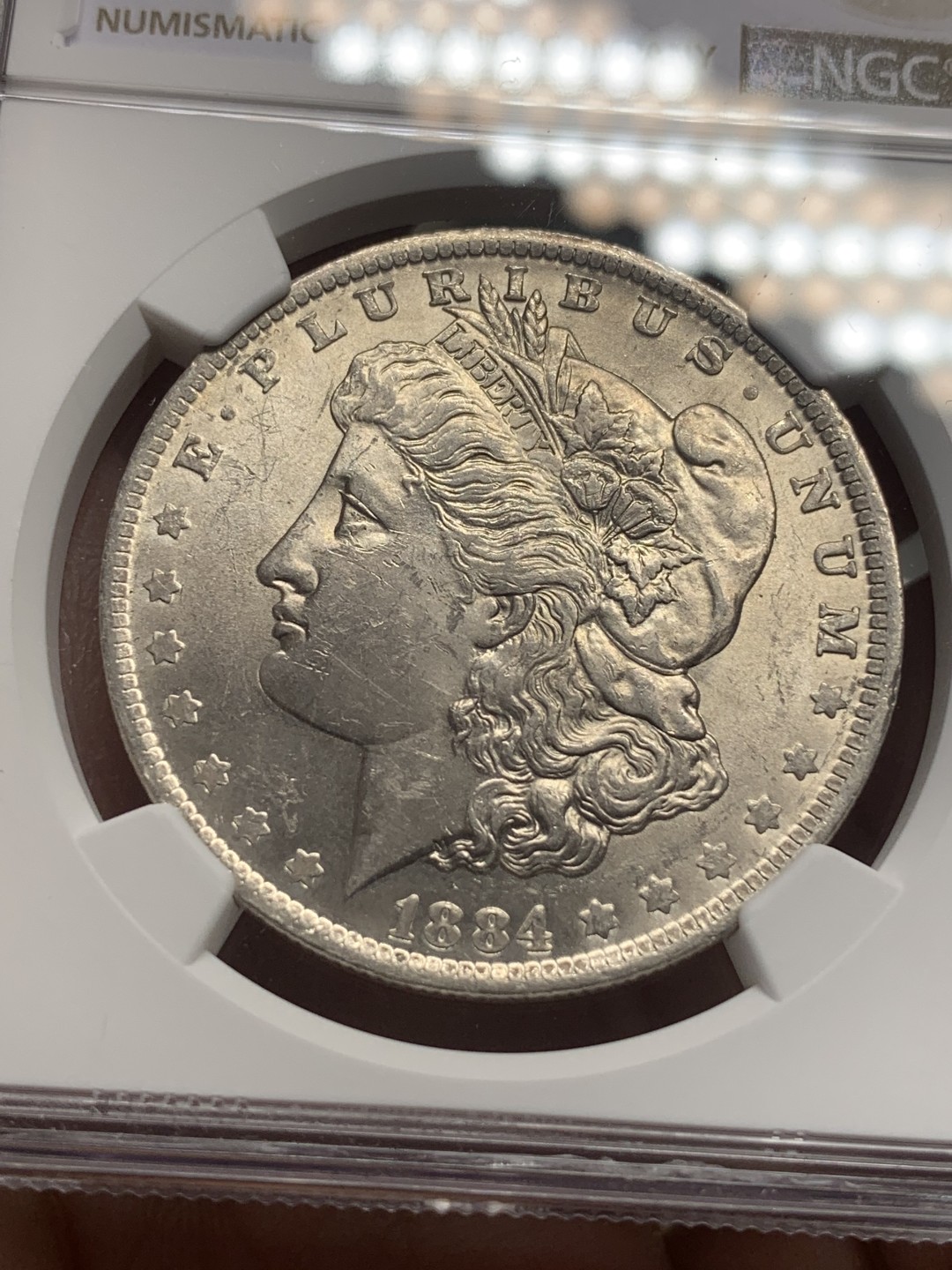 《竞宝斋》第111场-周日，周一 ，2场连拍（全场包邮） NGC-UNC 美国1884-O年 摩根一元大银币 原光好品