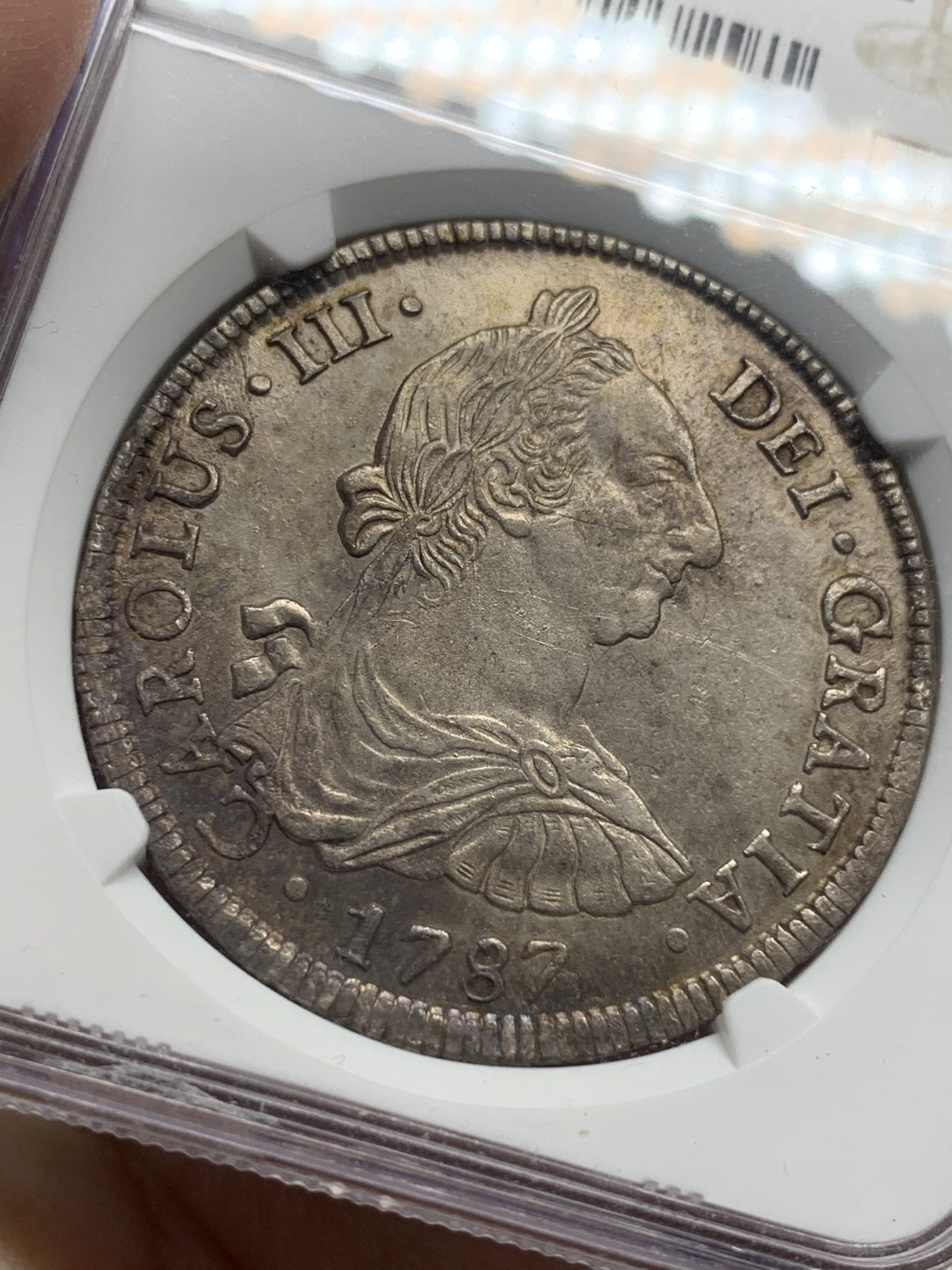 《竞宝斋》第111场-周日，周一 ，2场连拍（全场包邮） NGC UNC 玻利维亚 1787年 卡三 双柱大银币 标签为包浆等同于P97标签，可收藏