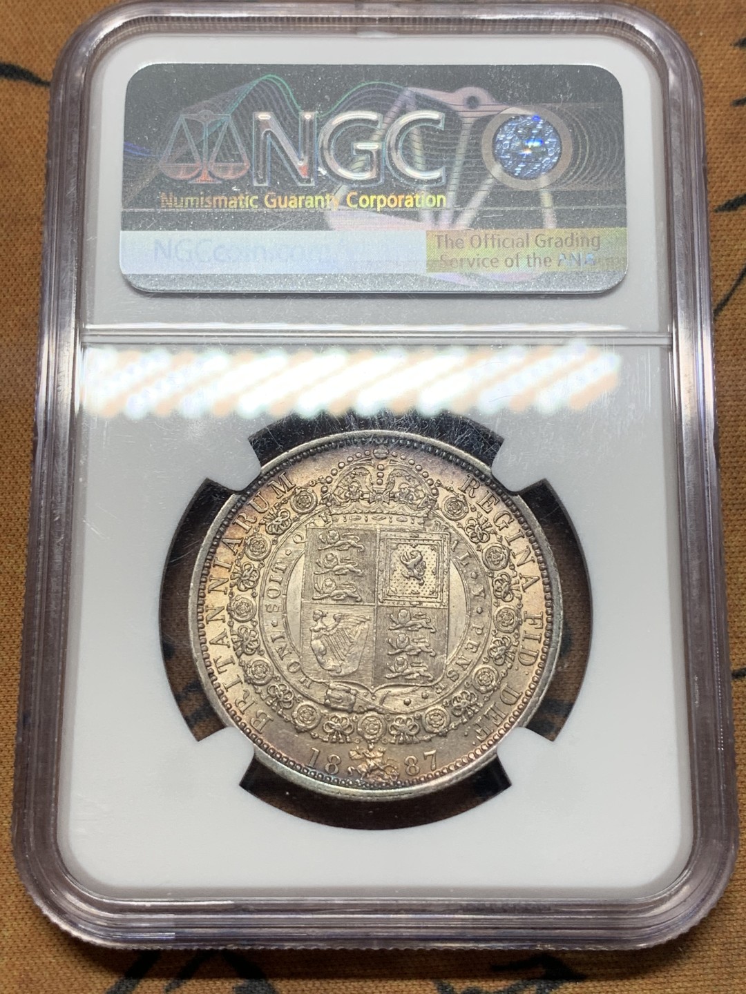 《竞宝斋》第111场-周日，周一 ，2场连拍（全场包邮） NGC AU58 1887 英国维多利亚女王1/2克朗银币 带彩包浆非常漂亮