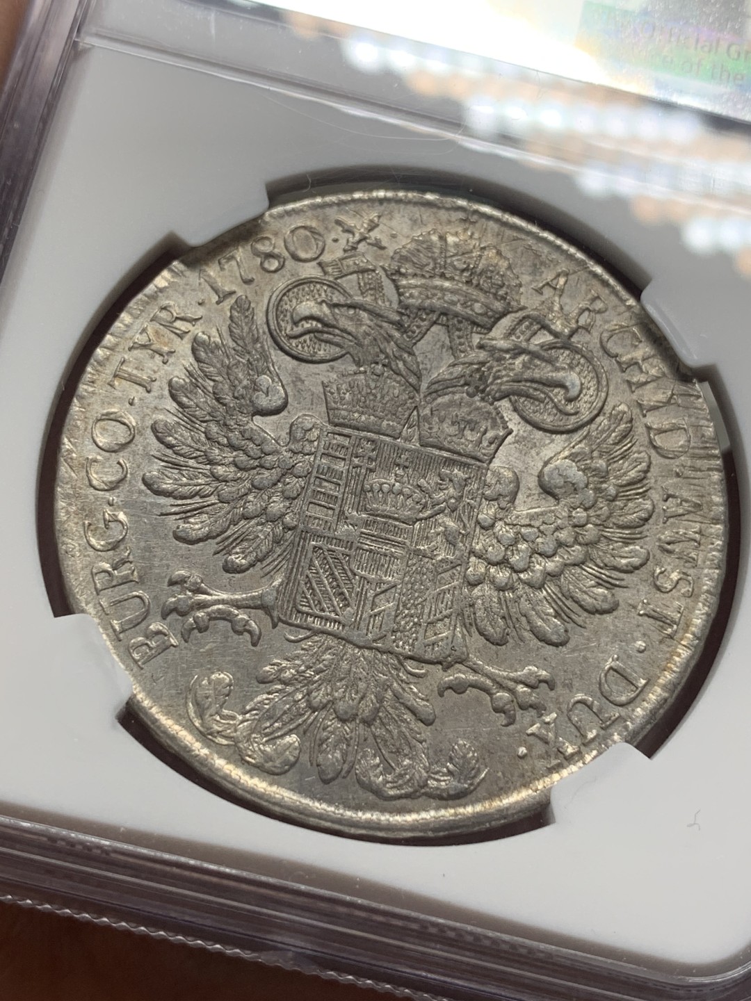 《竞宝斋》第111场-周日，周一 ，2场连拍（全场包邮） NGC-AUD 奥地利“1780年”特蕾莎1泰勒银币 1817-1833年铸造 威尼斯 对应目录编号应该是37a N就给了早期后铸缺失精准