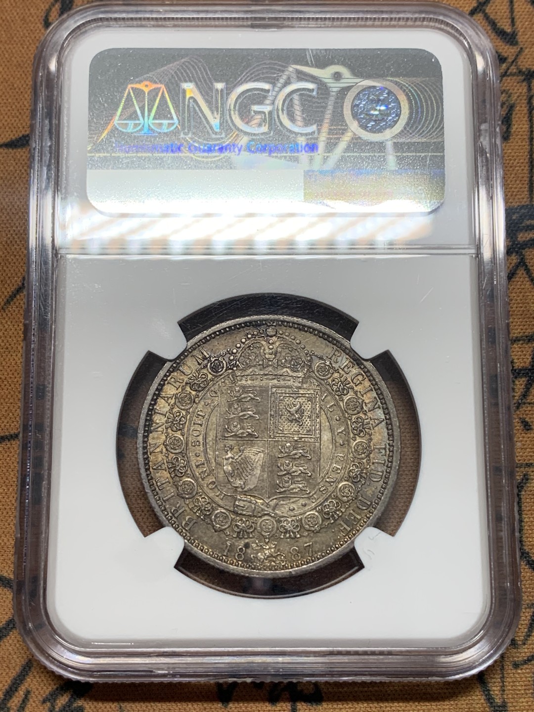 《竞宝斋》第111场-周日，周一 ，2场连拍（全场包邮） NGC-MS63 1887年 英国维多利亚高冠半克朗银币 重彩包浆 底板好 非常漂亮的一颗