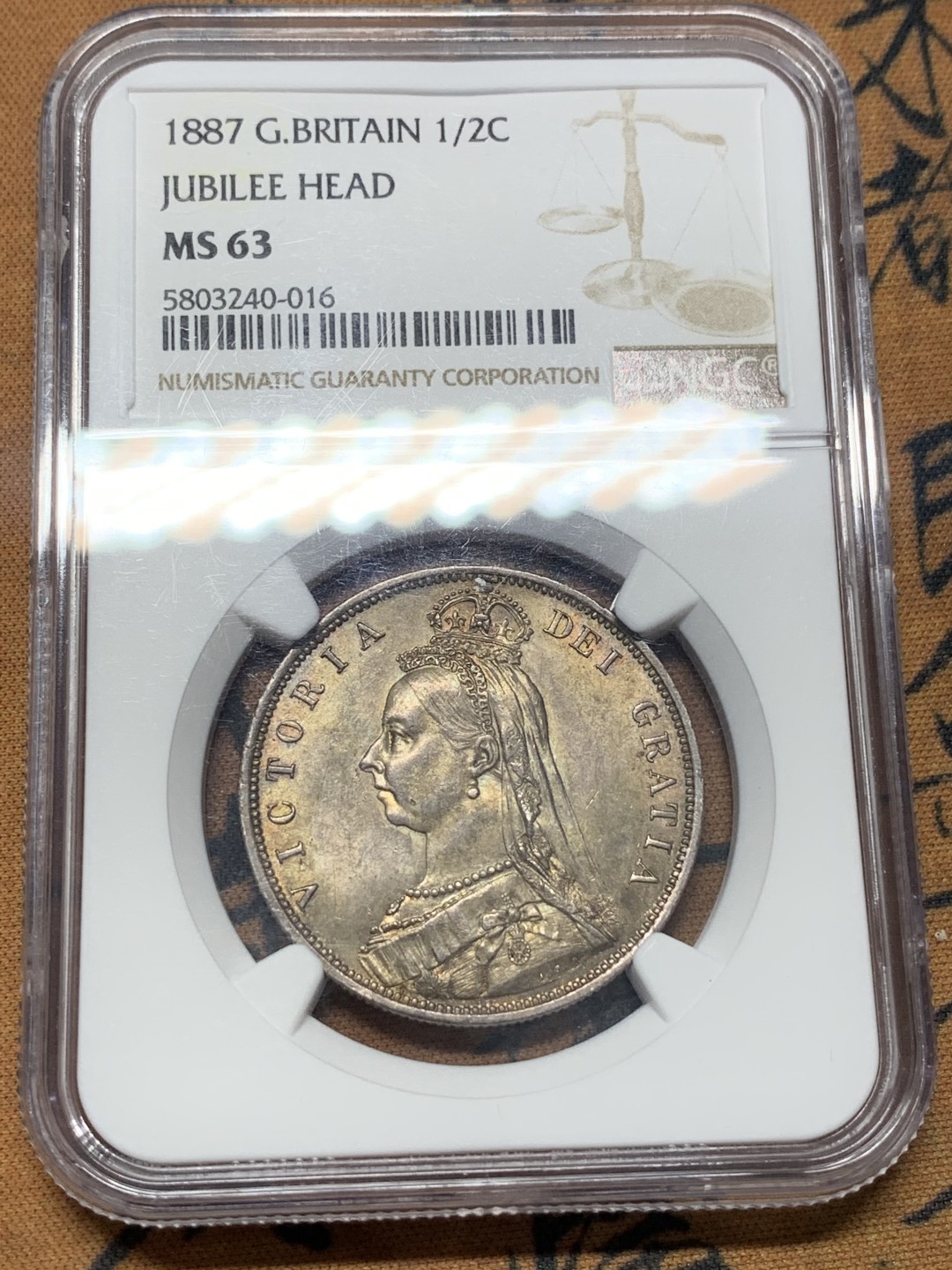 《竞宝斋》第111场-周日，周一 ，2场连拍（全场包邮） NGC-MS63 1887年 英国维多利亚高冠半克朗银币 重彩包浆 底板好 非常漂亮的一颗