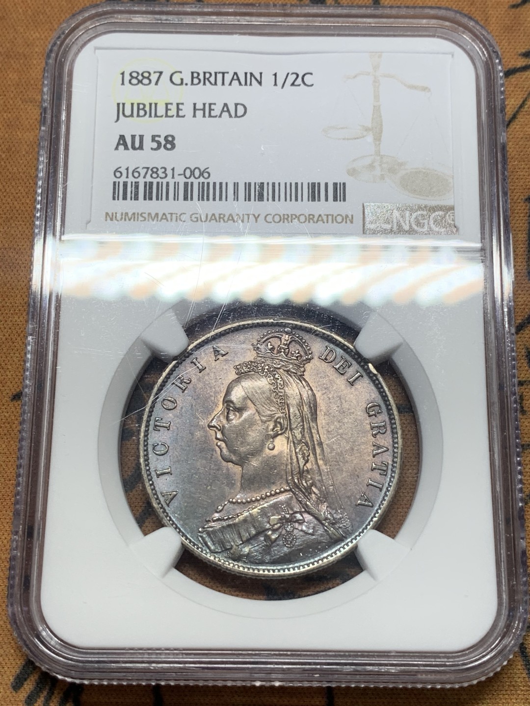 《竞宝斋》第111场-周日，周一 ，2场连拍（全场包邮） NGC AU58 1887 英国维多利亚女王1/2克朗银币 带彩包浆非常漂亮