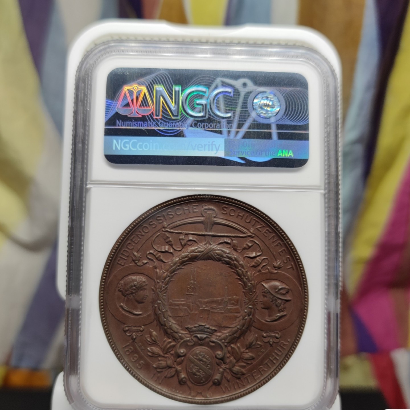 八角银章NGC章牌特卖会 瑞士1895射击节拿花女神铜章