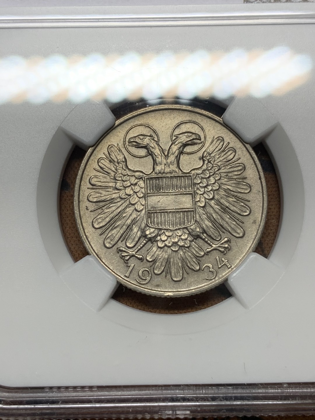 《竞宝斋》第112场-周日，周一 ，2场连拍（全场包邮） 冠军分 NGC-MS62 奥地利1934年 双头鹰1先令 镍币