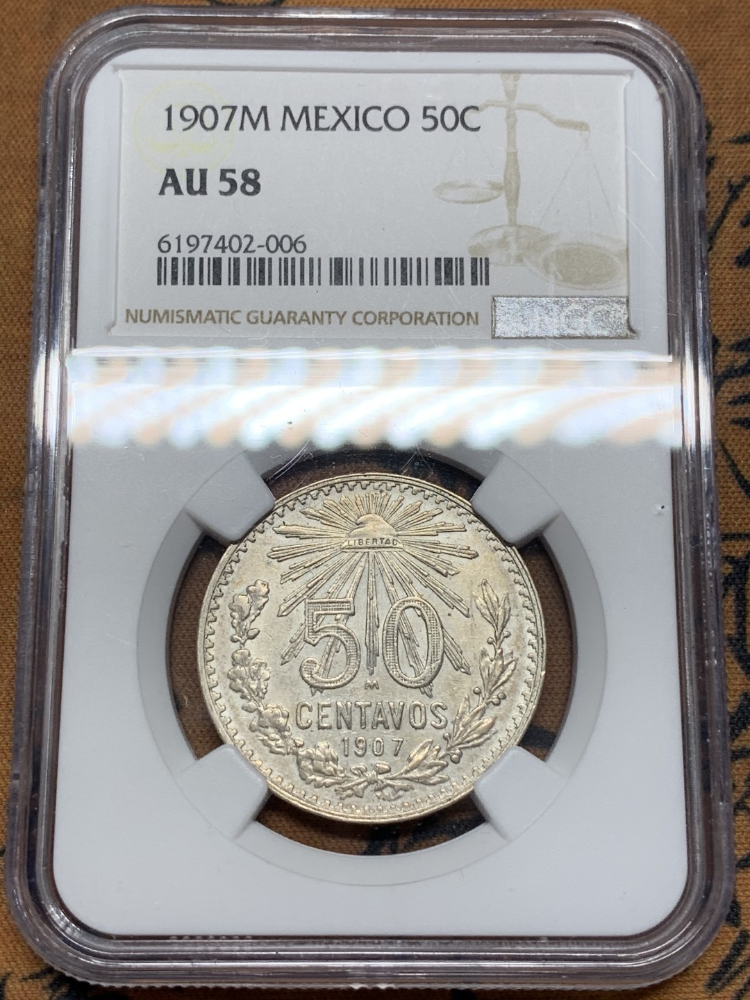 《竞宝斋》第112场-周日，周一 ，2场连拍（全场包邮） NGC-AU58 1907M NGC季军分，墨西哥50分银币 经典墨西哥鹰洋 此版早期年份，不是后期三四十年代的版本，高分稀见