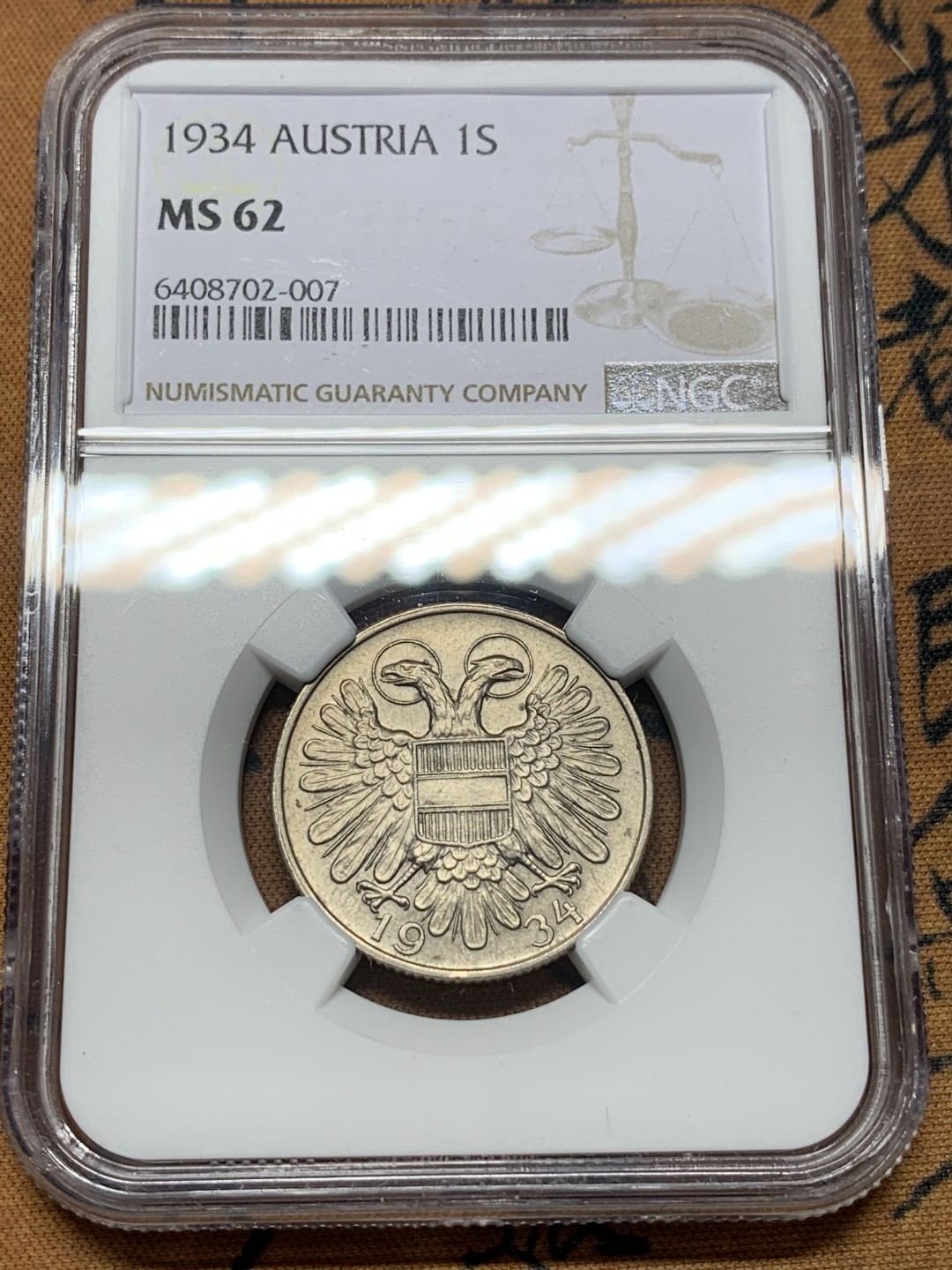 《竞宝斋》第112场-周日，周一 ，2场连拍（全场包邮） 冠军分 NGC-MS62 奥地利1934年 双头鹰1先令 镍币