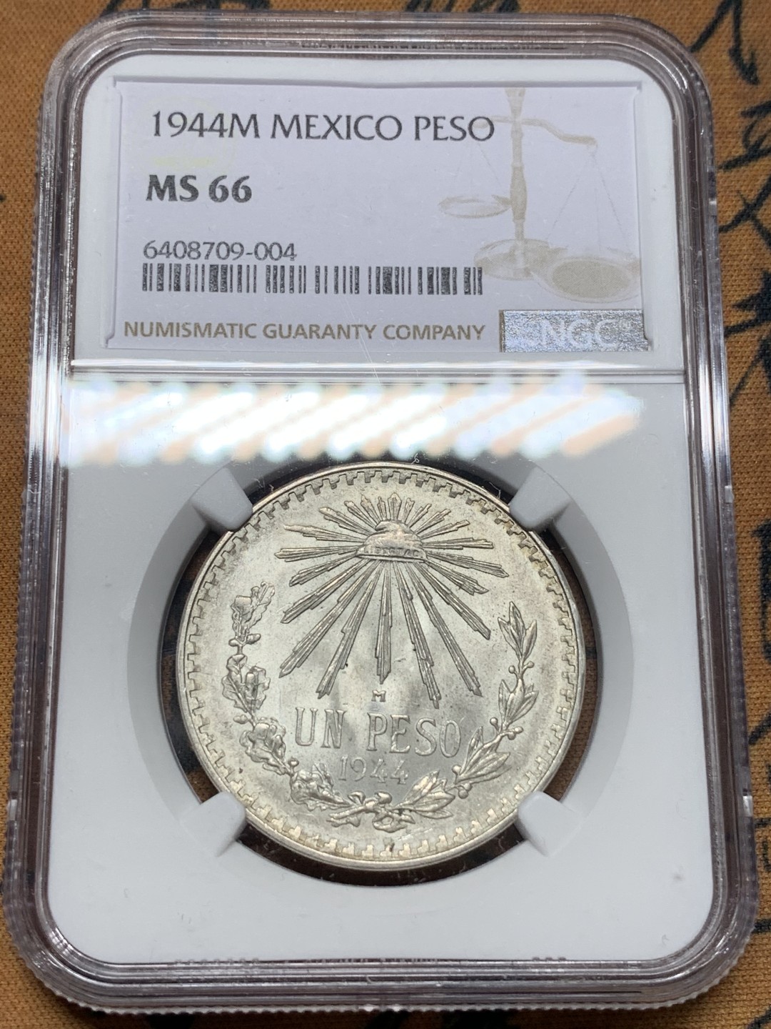 《竞宝斋》第112场-周日，周一 ，2场连拍（全场包邮） NGC-MS66 墨西哥1944年 小鹰洋1比索 这分数都不多说了