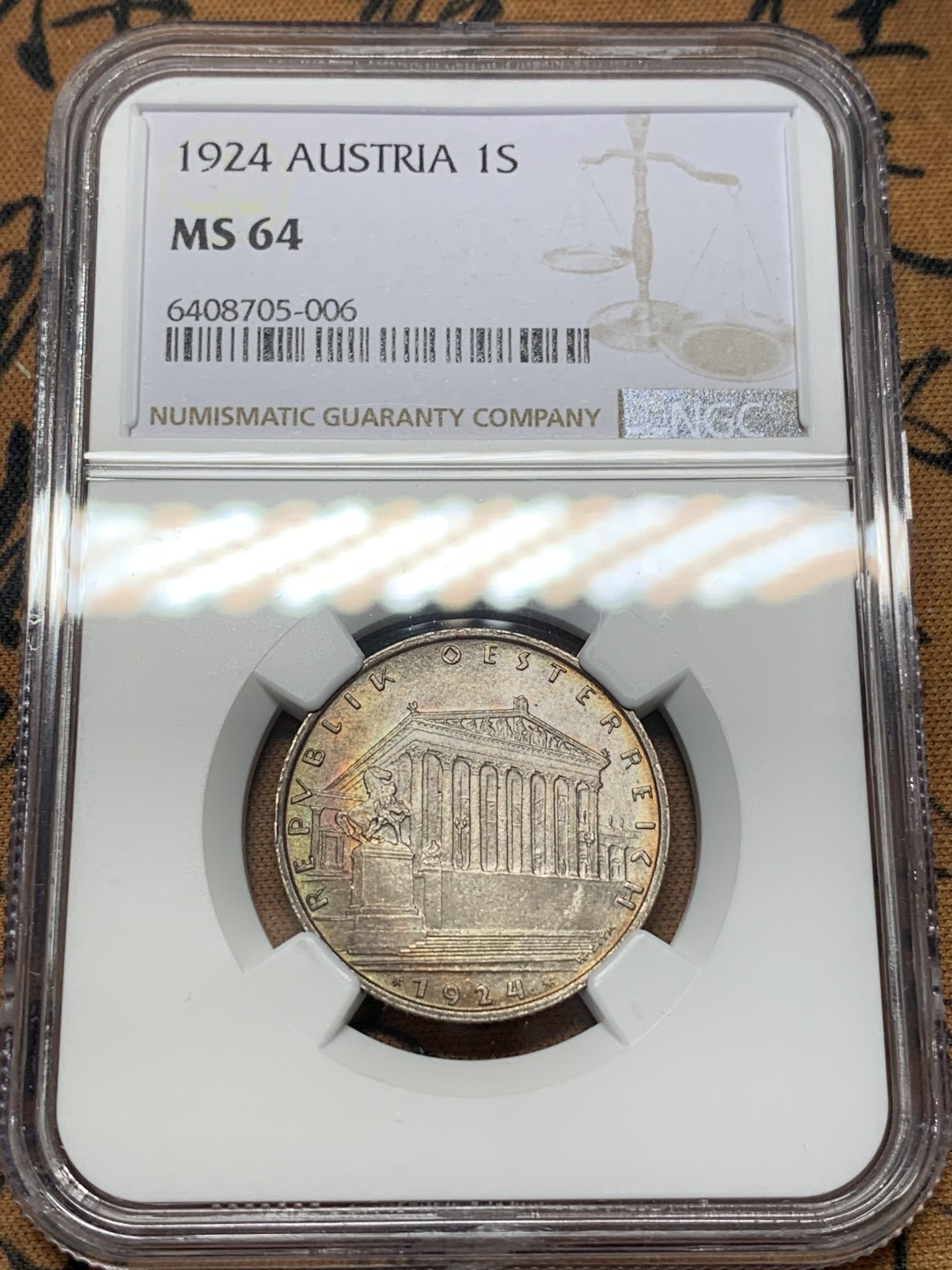 《竞宝斋》第112场-周日，周一 ，2场连拍（全场包邮） 第三名 NGC-MS64 奥地利1924年 维也纳会议大厅 1先令银币 带点月牙彩 非常漂亮