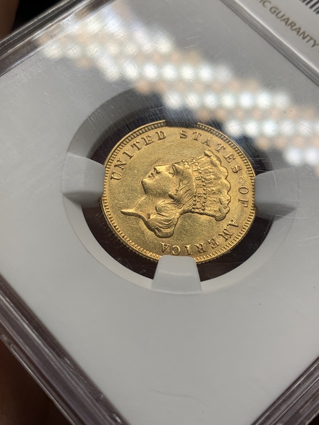 《竞宝斋》第112场-周日，周一 ，2场连拍（全场包邮） NGC-AU58 美国印第安公主 1874年20周年 3美金金币 20.5mm 5.015克 900金 多数在美国内战及罗斯福二战等被多次熔炉 存世量极少 该枚低评