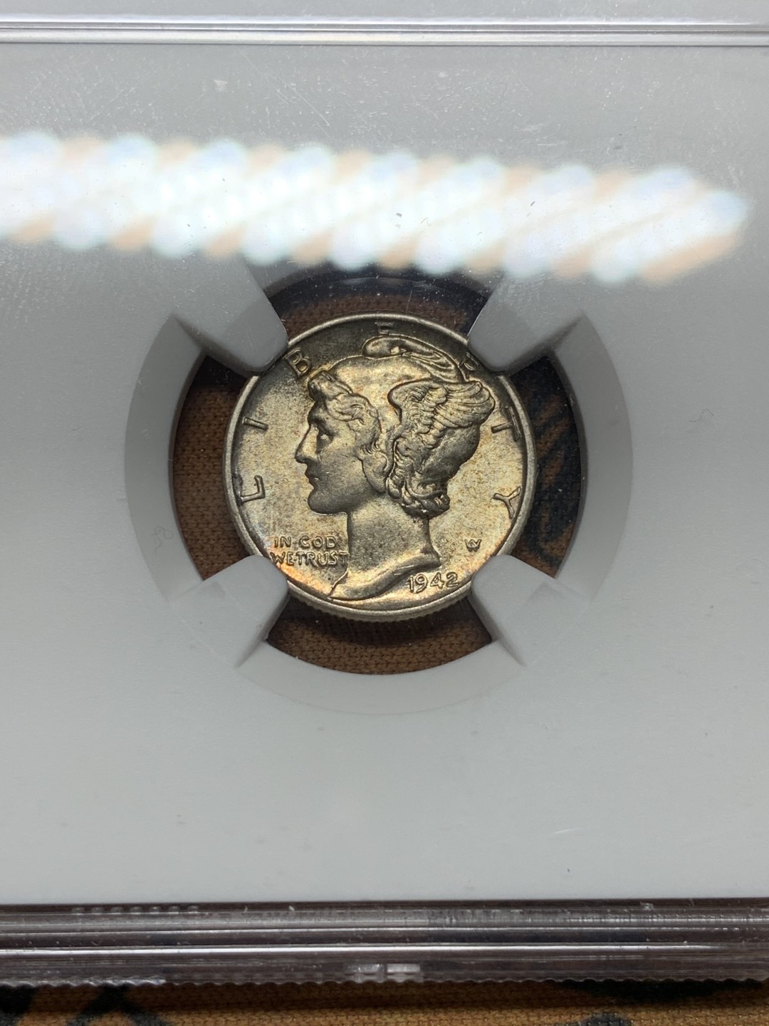 《竞宝斋》第113场-周日，周一 ，2场连拍（全场包邮） NGC AU58 美国 1942年 小飞侠 10分银币 包浆不错