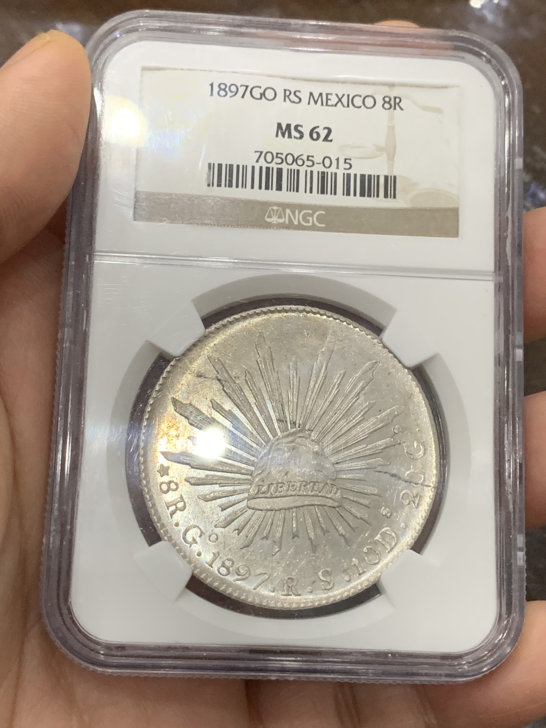 《竞宝斋》第113场-周日，周一 ，2场连拍（全场包邮） NGC-MS62 墨西哥1897年 8瑞尔 花边鹰洋 银币 镜面效果明显 车轮转光 同品相中的战斗机