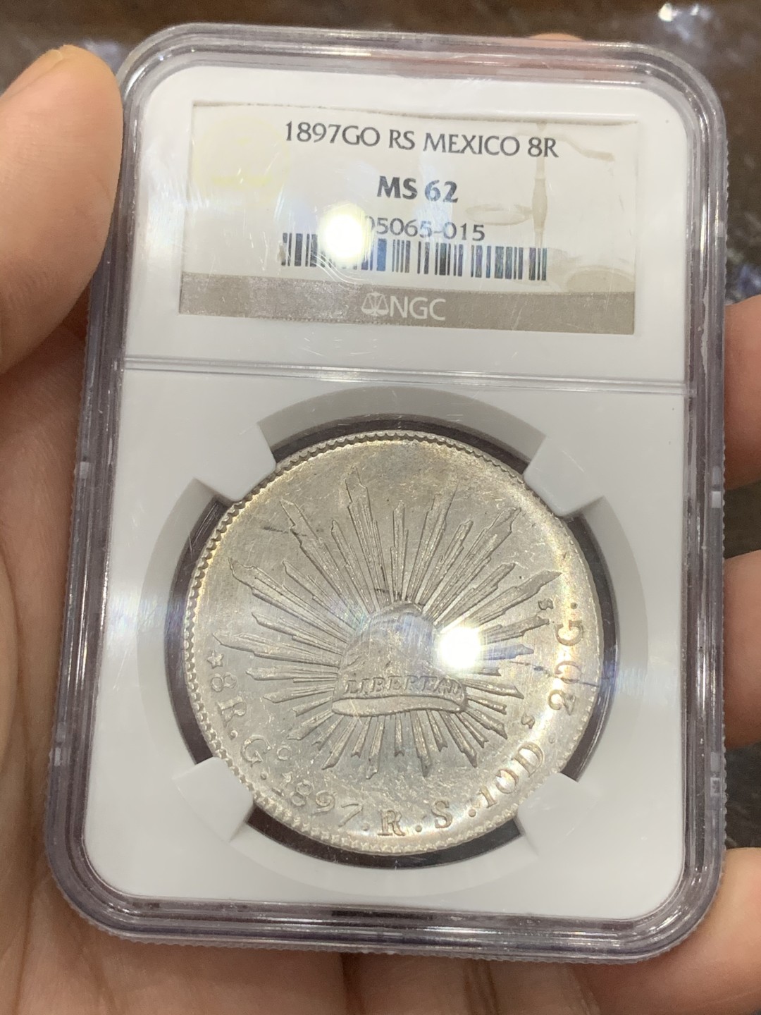 《竞宝斋》第113场-周日，周一 ，2场连拍（全场包邮） NGC-MS62 墨西哥1897年 8瑞尔 花边鹰洋 银币 镜面效果明显 车轮转光 同品相中的战斗机