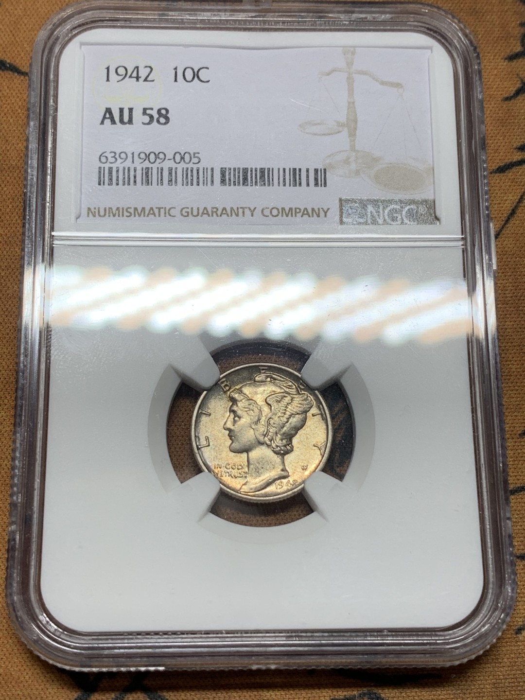 《竞宝斋》第113场-周日，周一 ，2场连拍（全场包邮） NGC AU58 美国 1942年 小飞侠 10分银币 包浆不错