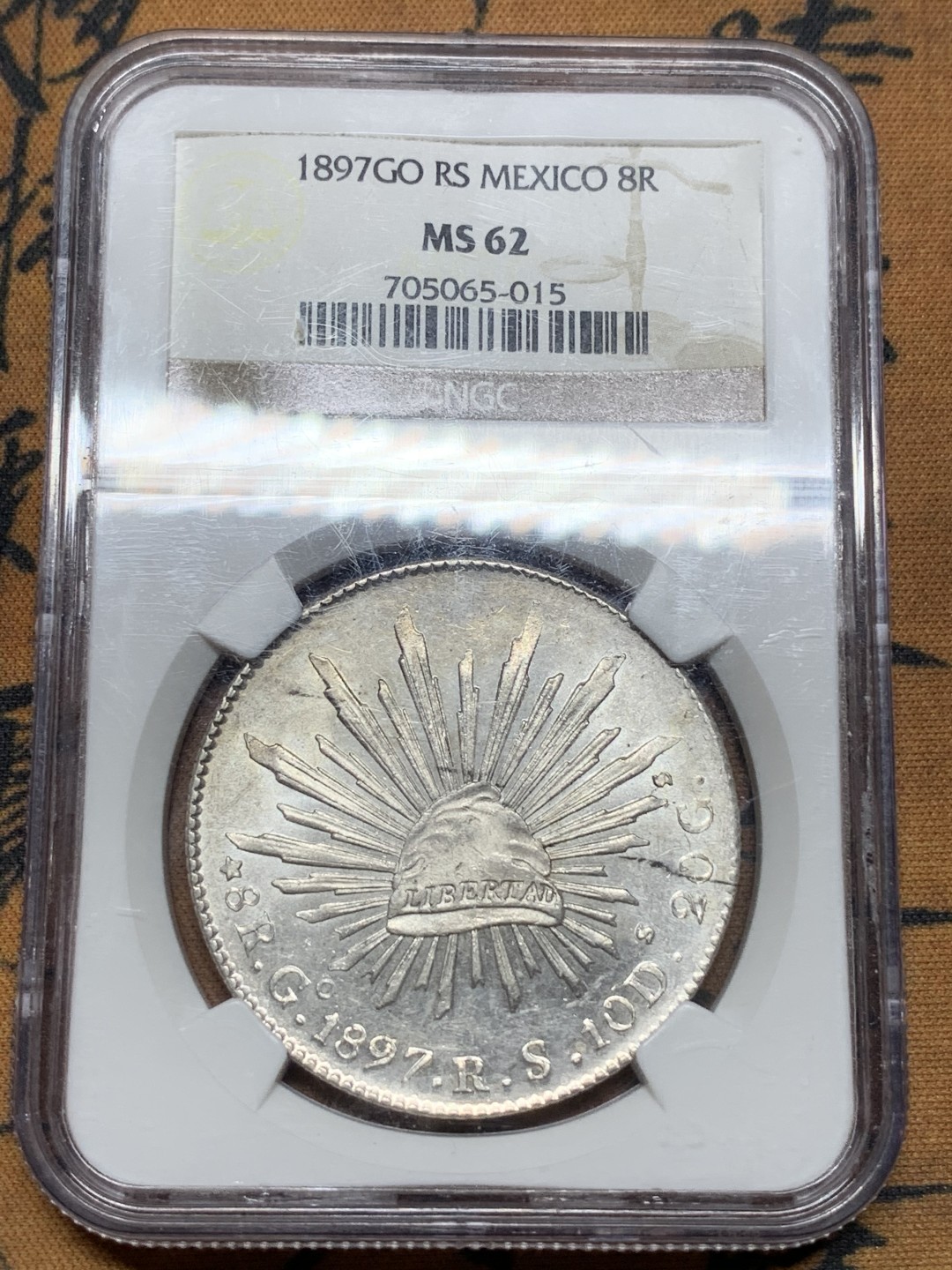 《竞宝斋》第113场-周日，周一 ，2场连拍（全场包邮） NGC-MS62 墨西哥1897年 8瑞尔 花边鹰洋 银币 镜面效果明显 车轮转光 同品相中的战斗机