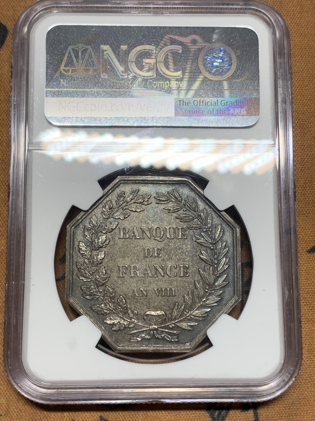 《竞宝斋》第113场-周日，周一 ，2场连拍（全场包邮） NGC MS63 法国 1900年法兰西银行百年纪念八角银章代用币 原味包浆深五彩