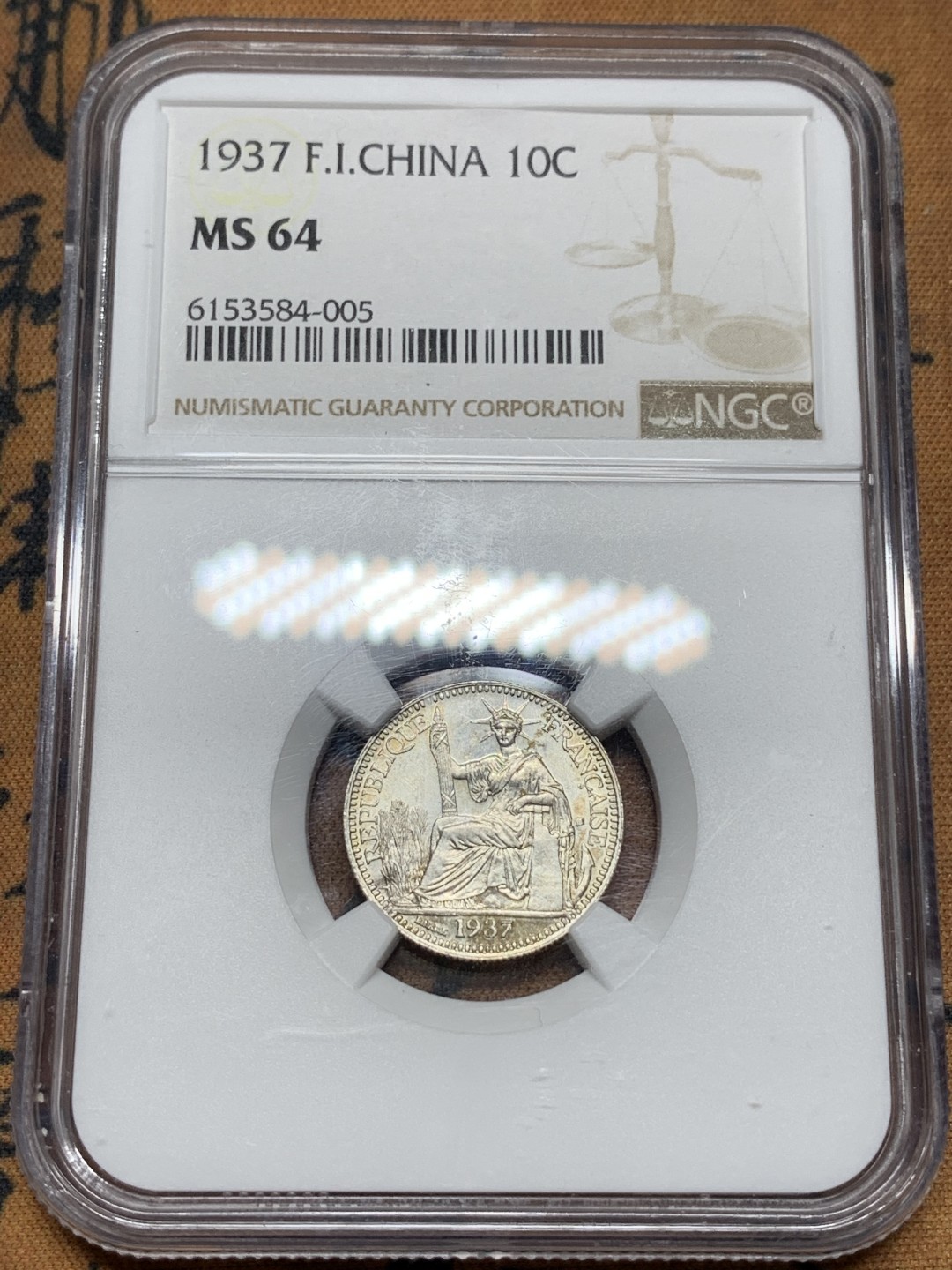 《竞宝斋》第113场-周日，周一 ，2场连拍（全场包邮） NGC MS64 1937年法属印支坐洋10分银币 压印十分好的一枚