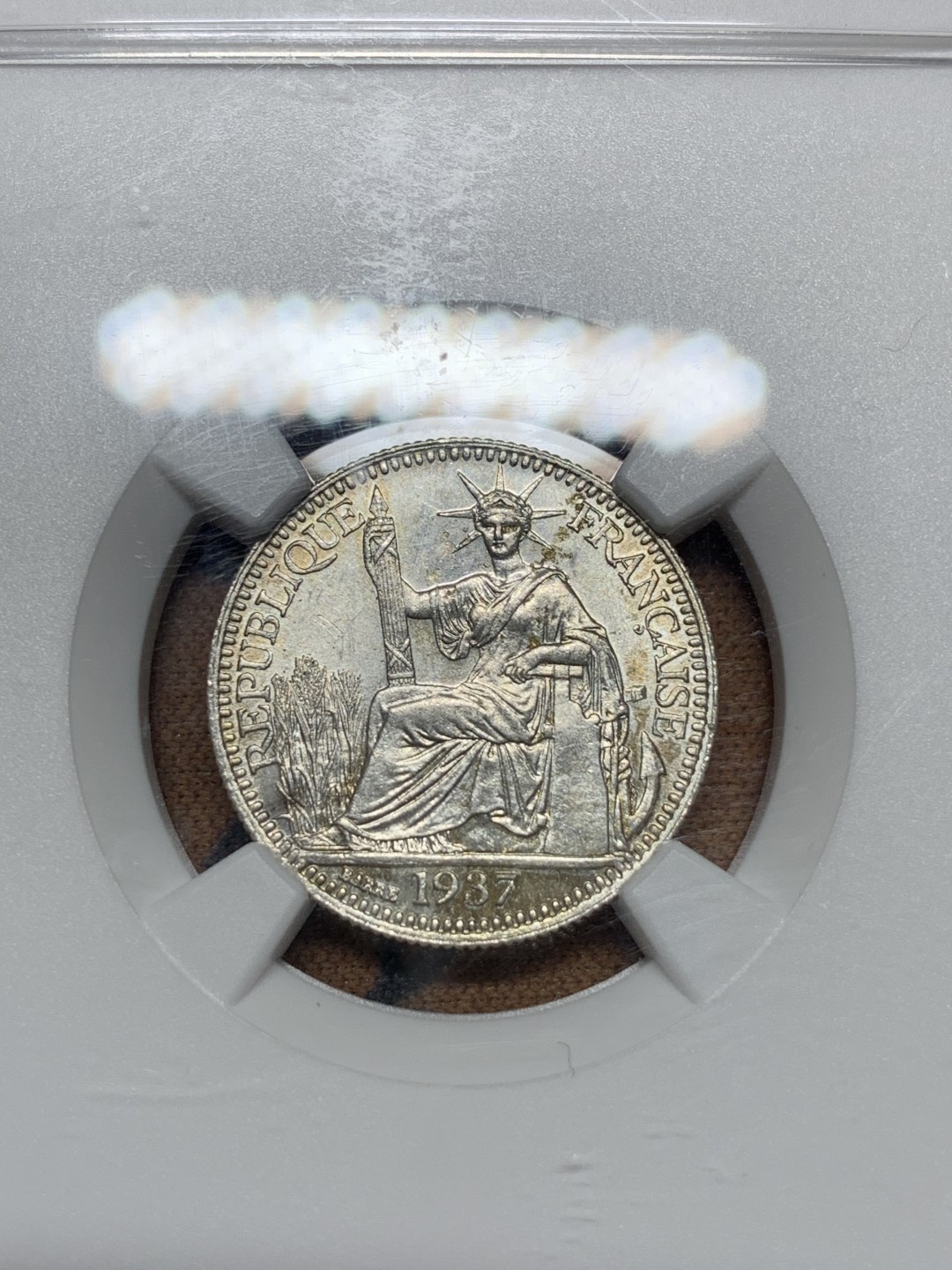 《竞宝斋》第113场-周日，周一 ，2场连拍（全场包邮） NGC MS64 1937年法属印支坐洋10分银币 压印十分好的一枚