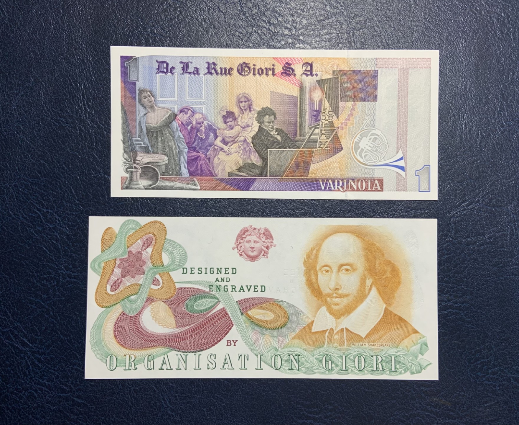 收藏联盟Quantum Auction 第205期拍卖 英国德纳罗公司1元贝多芬(雕刻版)和莎士比亚纪念券(深凹版)测试钞 品相全新UNC