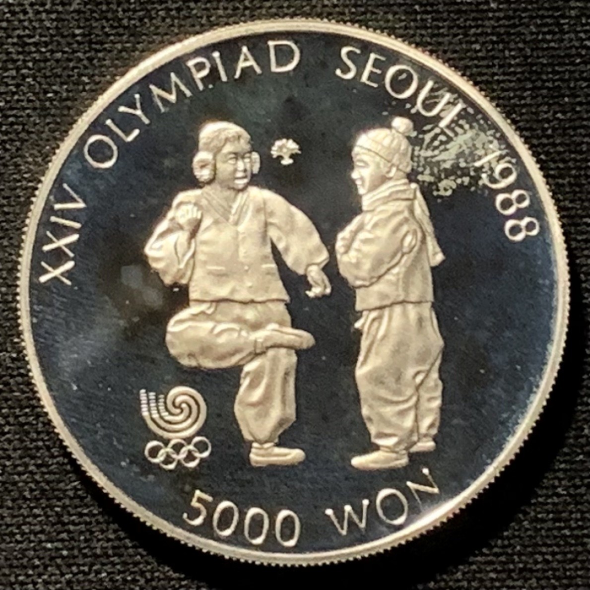 紫瑗钱币——第227期拍卖 韩国 1987年 汉城奥运会 踢毽子 5000韩元 16.81克 0.925银 精制
