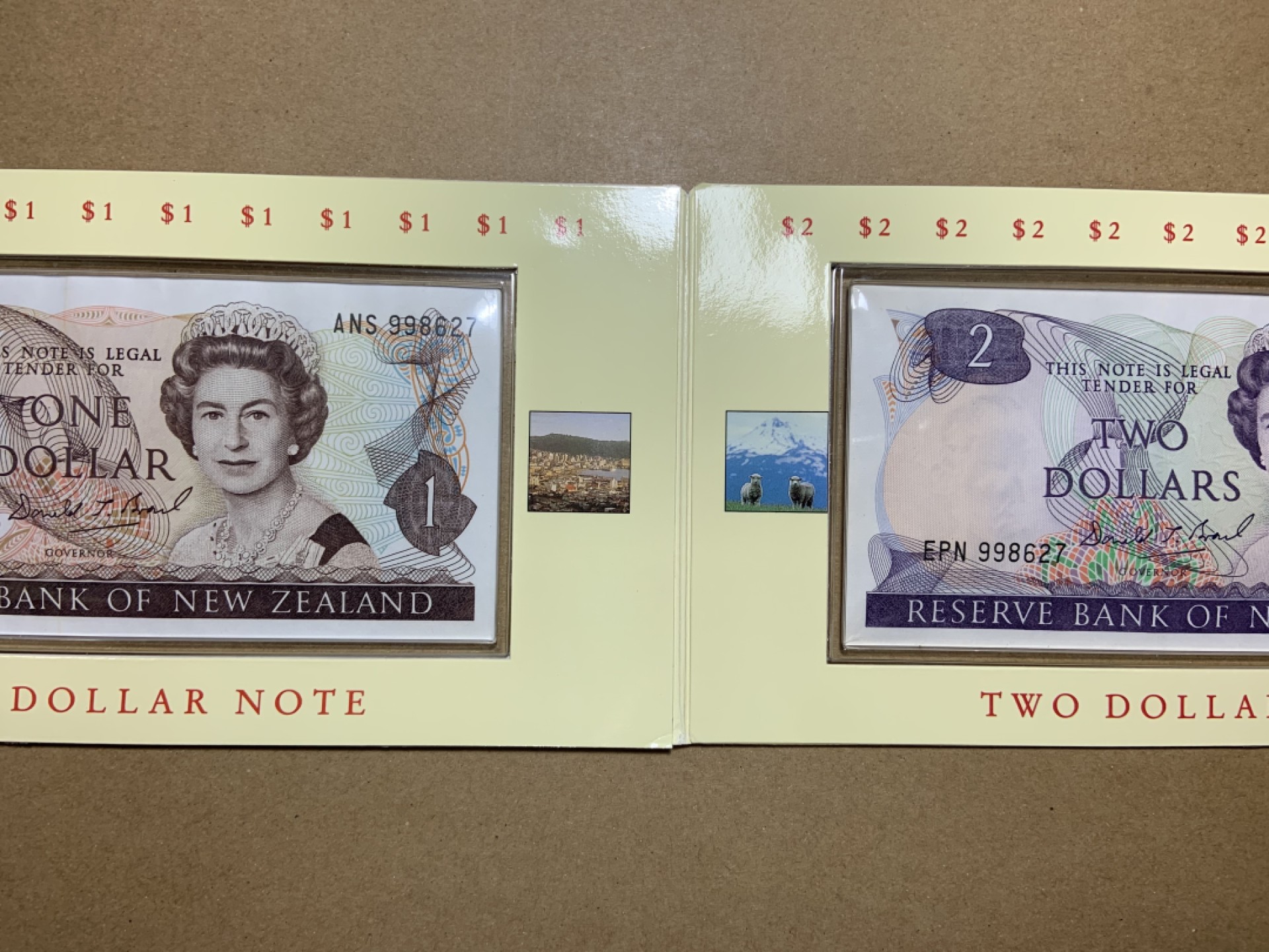 收藏联盟Quantum Auction 第207期拍卖 新西兰全同号1-2元纸币硬币册 品相unc- (存放在塑料册子里自然形成的边缘缺陷)