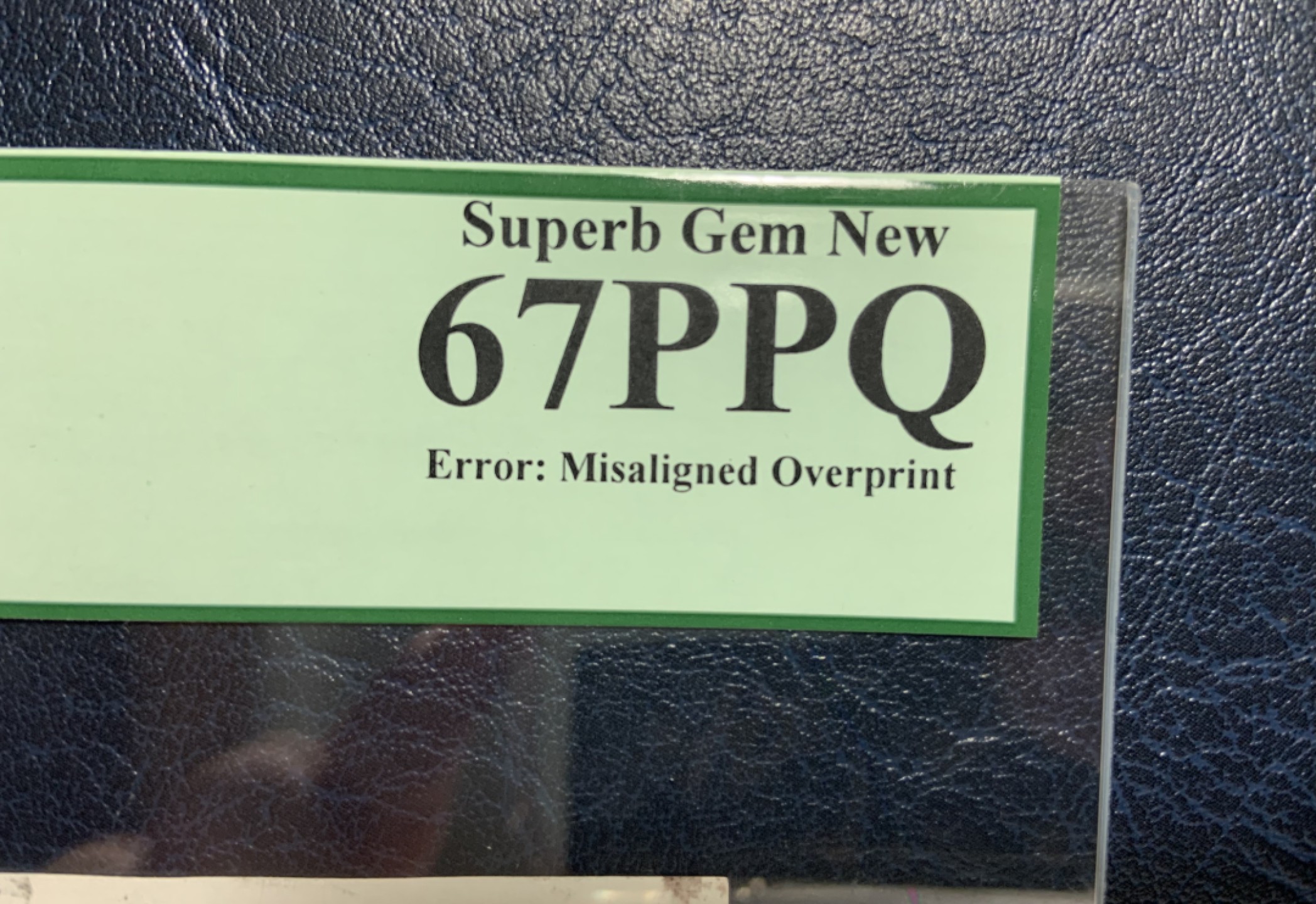 收藏联盟Quantum Auction 第207期拍卖 朝鲜2006年5000元 PCGS67 错版币(卡纸导致号码偏移，黑色划痕为质检笔) 带白边印钞纸整张纸币极少见