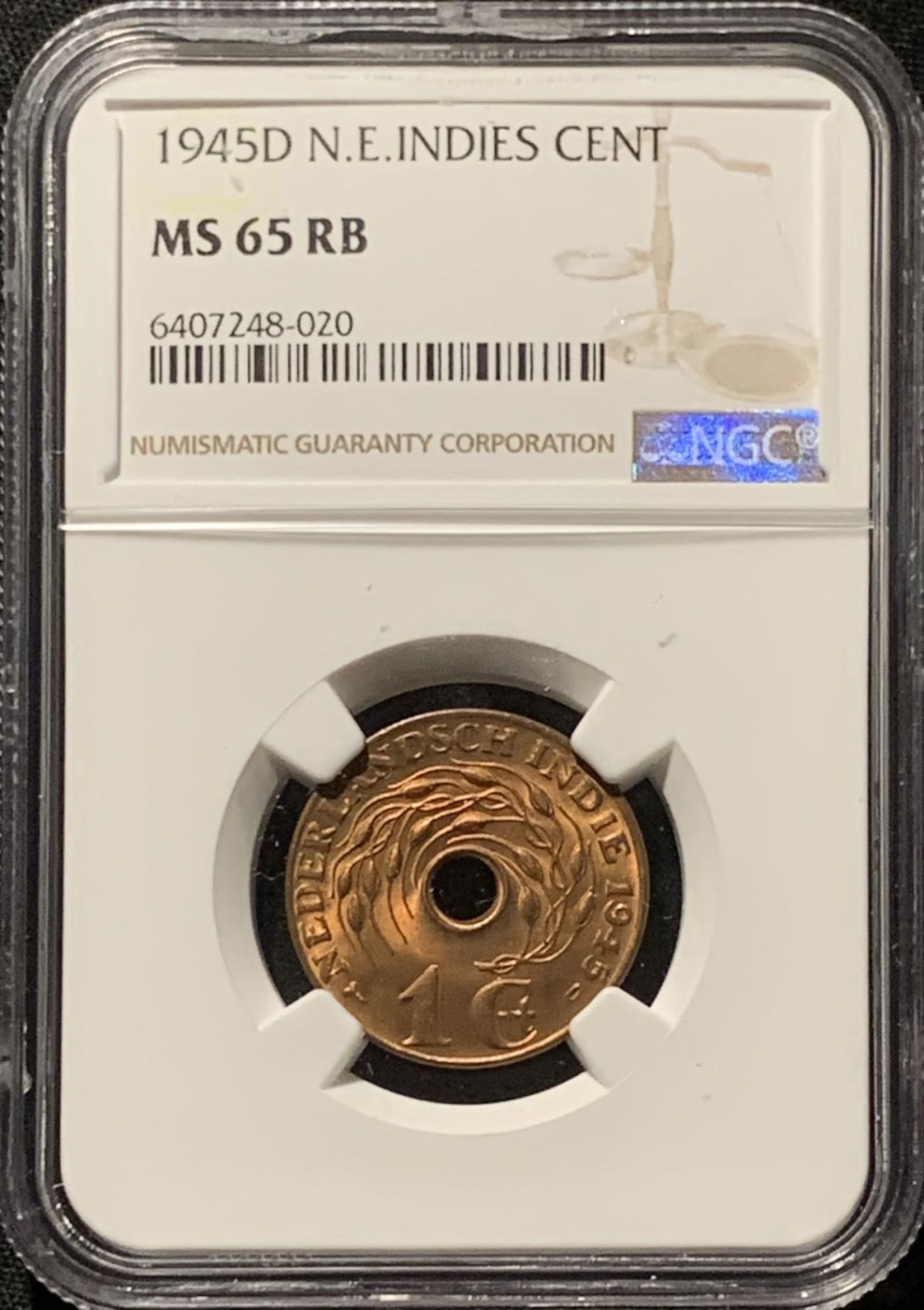 紫瑗钱币——第227期拍卖 荷属东印度 1945年 D版 中孔 1分 铜币 NGC MS65 RB
