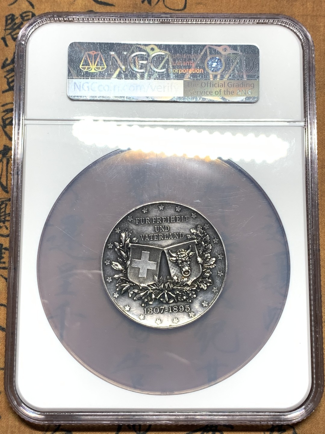 《竞宝斋》第115场-周日，周一 ，2场连拍（全场包邮） NGC UNC 1895年瑞士乌里州射击节大银章，50MM，厚重高浮雕，NGC大盒子,少见品种