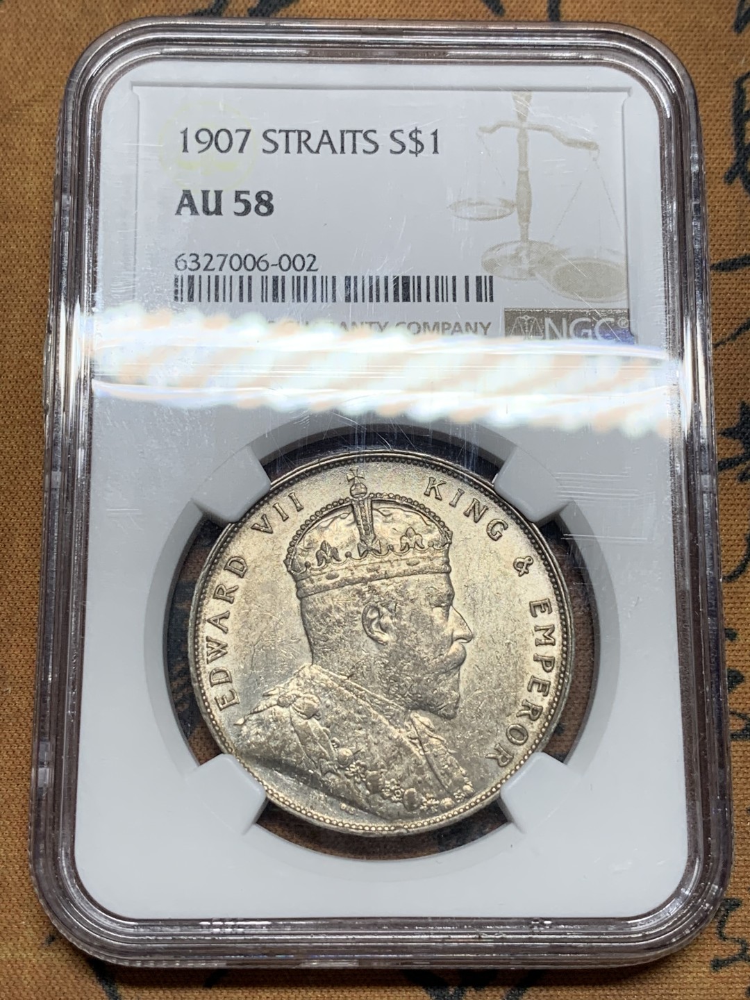 《竞宝斋》第115场-周日，周一 ，2场连拍（全场包邮） NGC AU58 英属海峡1907年爱七一元银币 带光好品