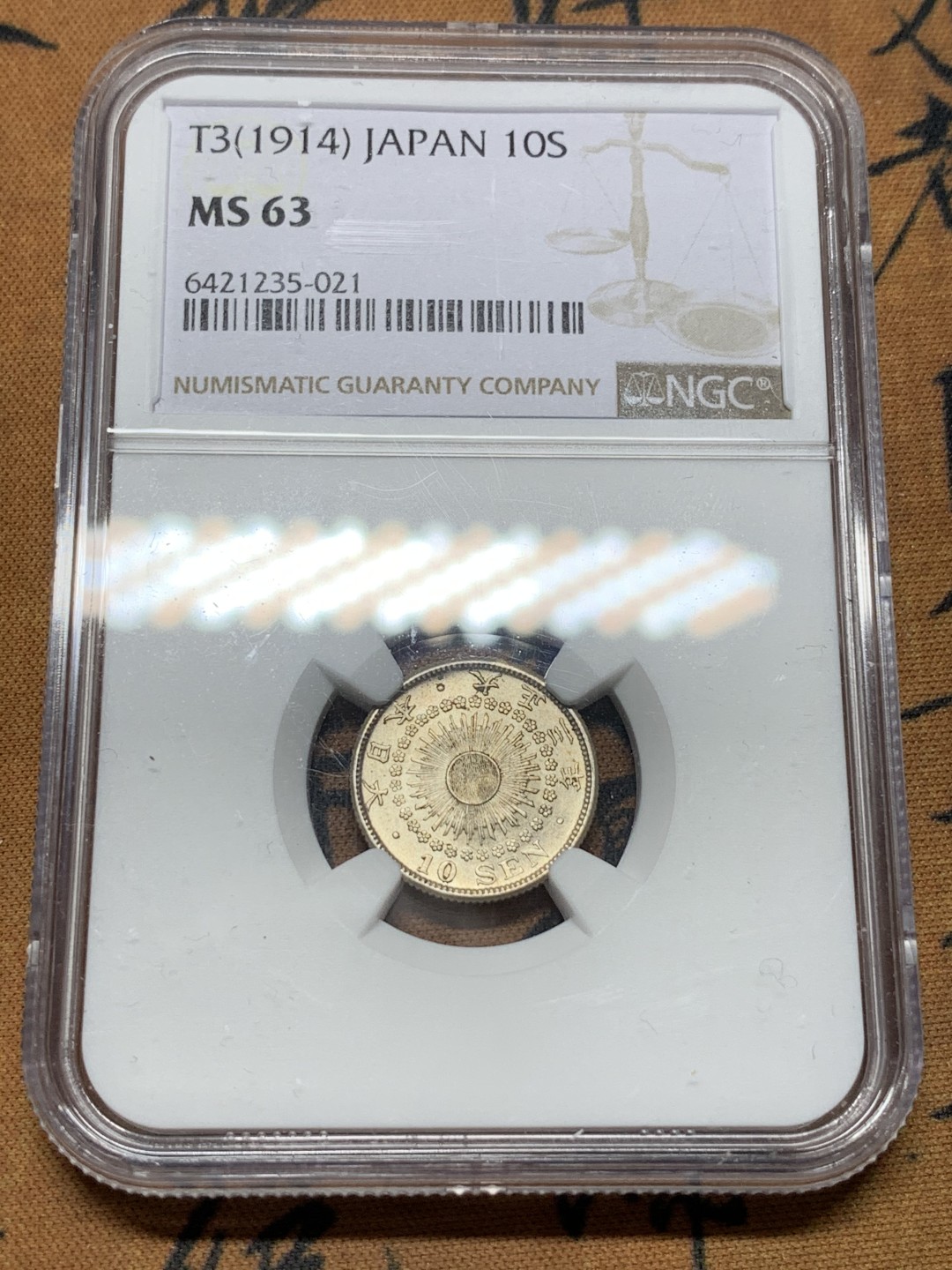 《竞宝斋》第116场-周日，周一 ，2场连拍（全场包邮） NGC-MS63 日本 1914 大正三年旭日十钱银币，完美转光，背面淡金色包浆，给分略感保守