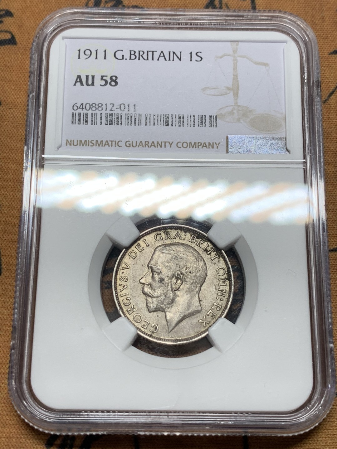 《竞宝斋》第116场-周日，周一 ，2场连拍（全场包邮） NGC AU58 英国 1911年乔治 五世 1先令铜币 原味包浆带底光 925高银版本