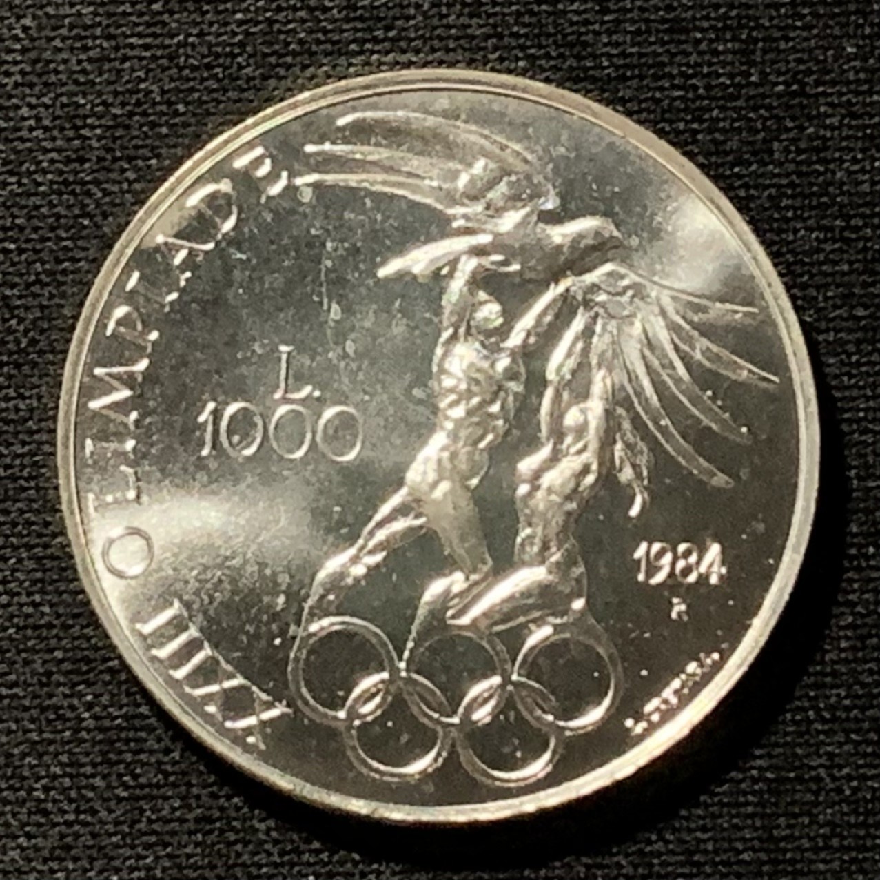 紫瑗钱币——第262期拍卖 圣马力诺 1984年 洛杉矶奥运会 五环 1000里拉 14.6克 0.835银 UNC