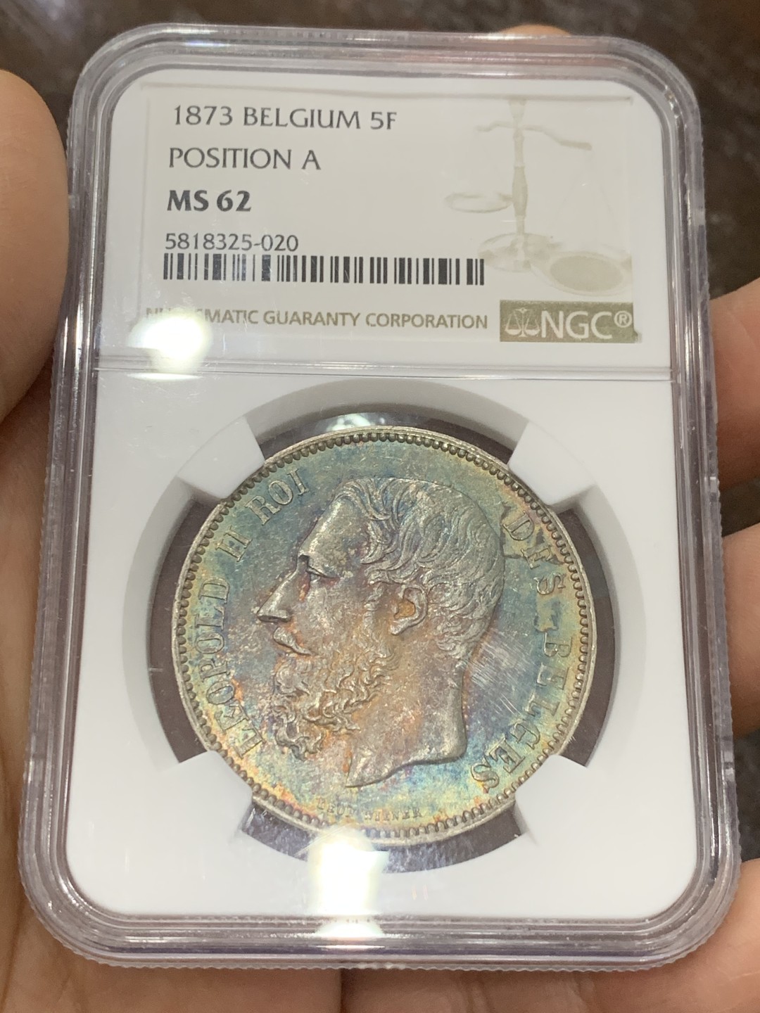 《竞宝斋》第121场-周日，周一 ，2场连拍（全场包邮） NGC-MS62 比利时1873年利奥波德二世5法郎大银币 正面全五彩 背面黄油转光 真正意义上的五彩 美轮美奂