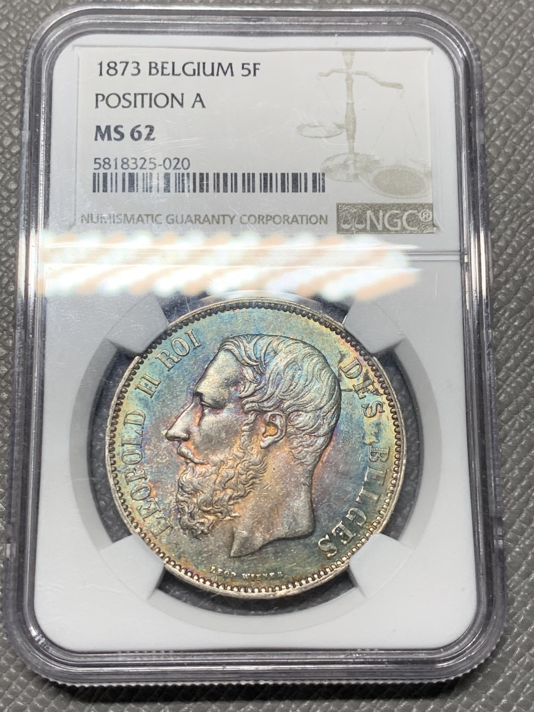 《竞宝斋》第121场-周日，周一 ，2场连拍（全场包邮） NGC-MS62 比利时1873年利奥波德二世5法郎大银币 正面全五彩 背面黄油转光 真正意义上的五彩 美轮美奂