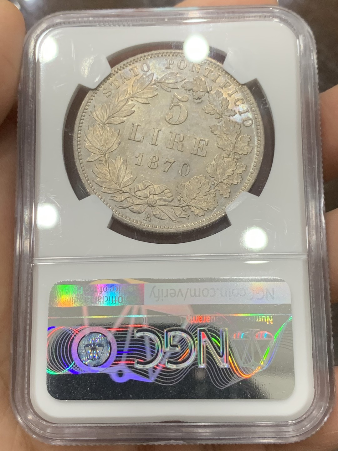 《竞宝斋》第121场-周日，周一 ，2场连拍（全场包邮） NGC-MS62 意大利教皇国 1870年 教皇庇护九世5里拉大银币 底板丝滑，细节锐利，均匀淡彩包浆 教皇国钱币在国外属于大热品种 克书及外拍价格都很高