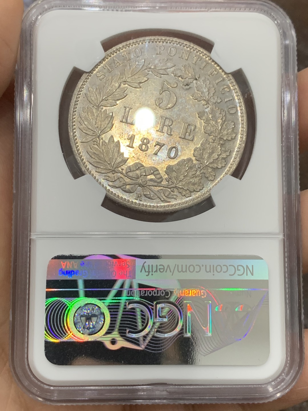 《竞宝斋》第121场-周日，周一 ，2场连拍（全场包邮） NGC-MS62 意大利教皇国 1870年 教皇庇护九世5里拉大银币 底板丝滑，细节锐利，均匀淡彩包浆 教皇国钱币在国外属于大热品种 克书及外拍价格都很高