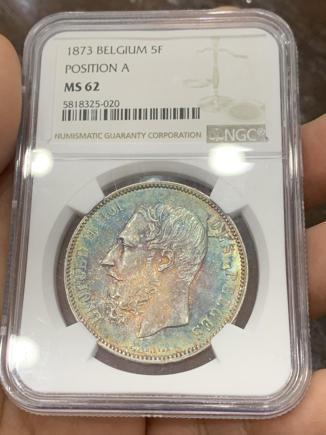 《竞宝斋》第121场-周日，周一 ，2场连拍（全场包邮） NGC-MS62 比利时1873年利奥波德二世5法郎大银币 正面全五彩 背面黄油转光 真正意义上的五彩 美轮美奂