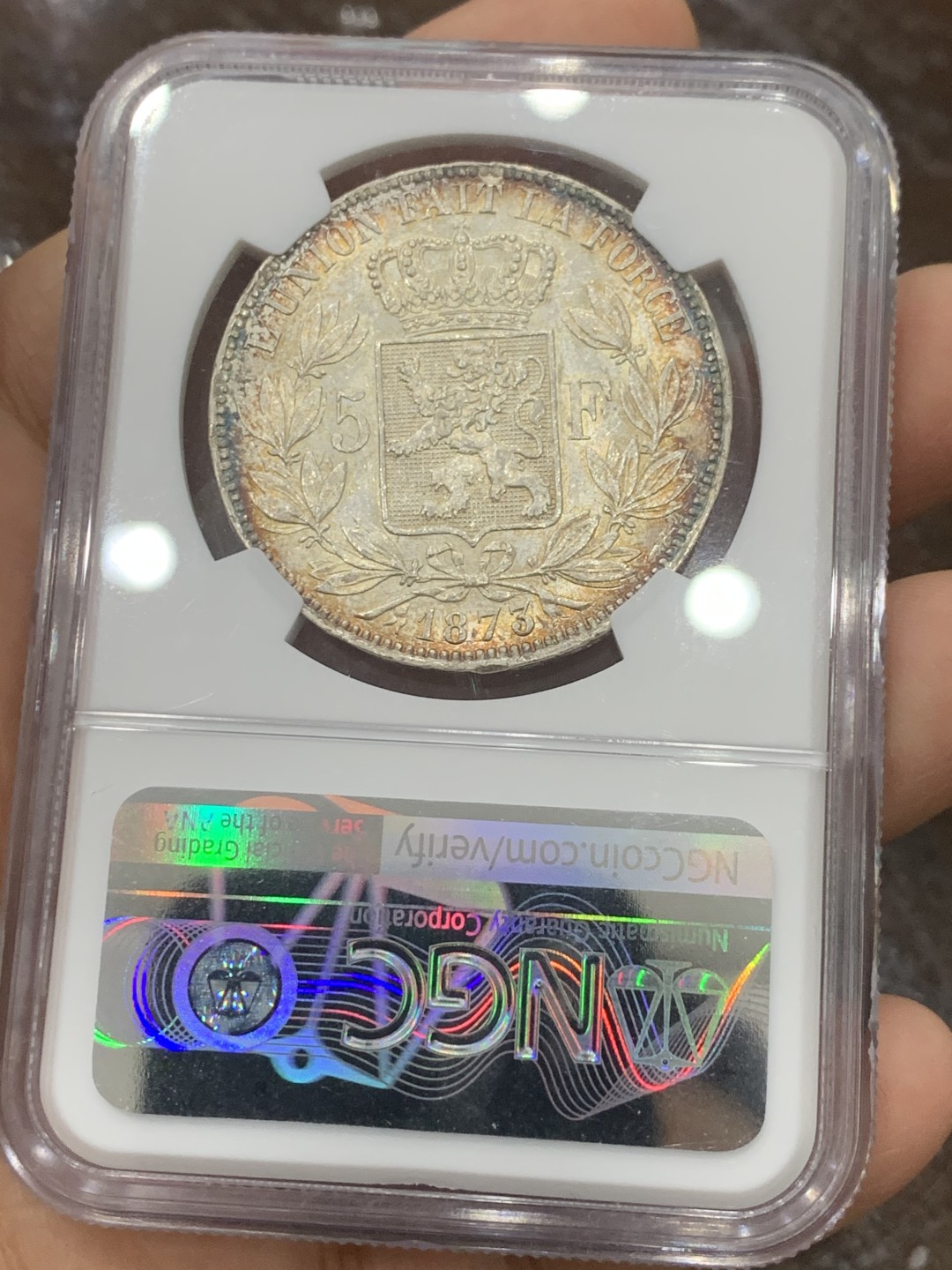 《竞宝斋》第121场-周日，周一 ，2场连拍（全场包邮） NGC-MS62 比利时1873年利奥波德二世5法郎大银币 正面全五彩 背面黄油转光 真正意义上的五彩 美轮美奂