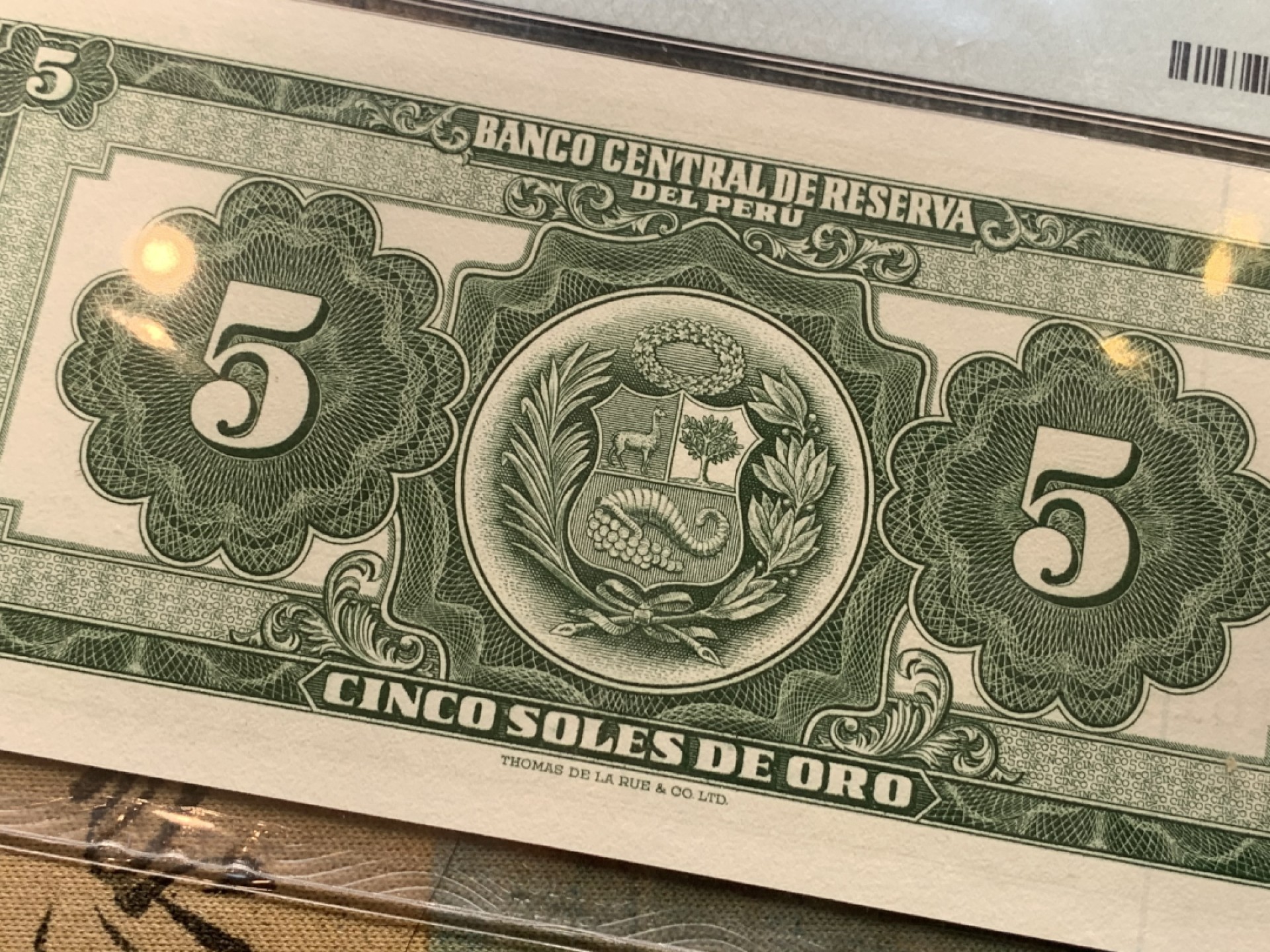 《竞宝斋》第121场-周日，周一 ，2场连拍（全场包邮） PMG-64 评级纸币2张一组，民国30年中央银行伍圆+秘鲁女神坐像5索尔。两张64同分，孙像+经典坐人女神