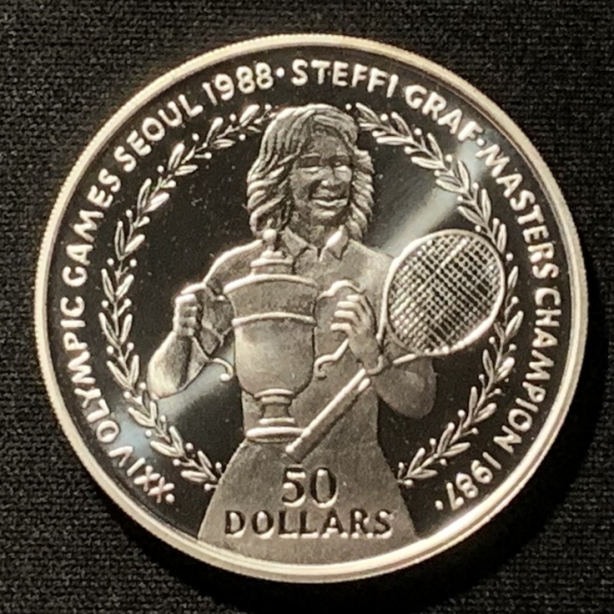 紫瑗钱币——第267期拍卖 纽埃 1988年 首尔奥运会 施特菲·格拉芙 50元 27.1克 0.625银 精制